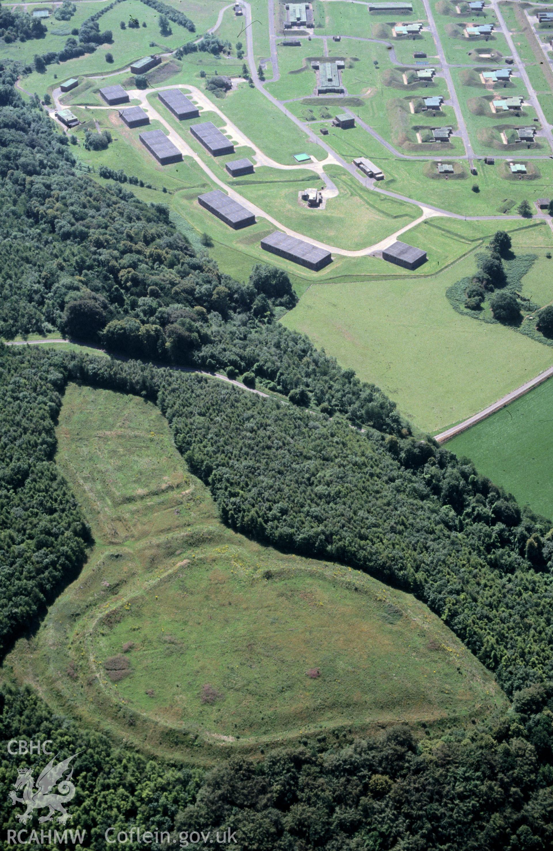 Slide of RCAHMW colour oblique aerial photograph of Llanmelin Camp, taken by C.R. Musson, 12/7/1990.