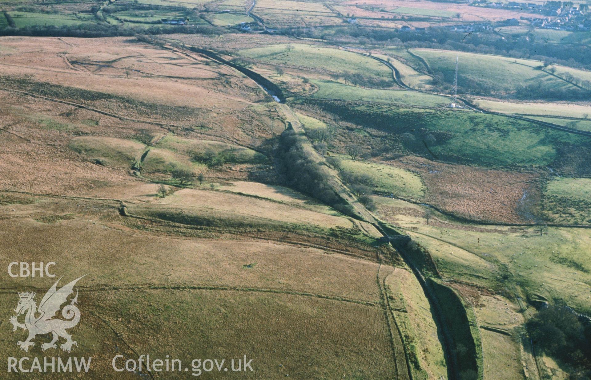 Slide of RCAHMW colour oblique aerial photograph of Nant-y-ffin Causeway, Brecon Forest Tramroad, taken by C.R. Musson, 24/11/1988.