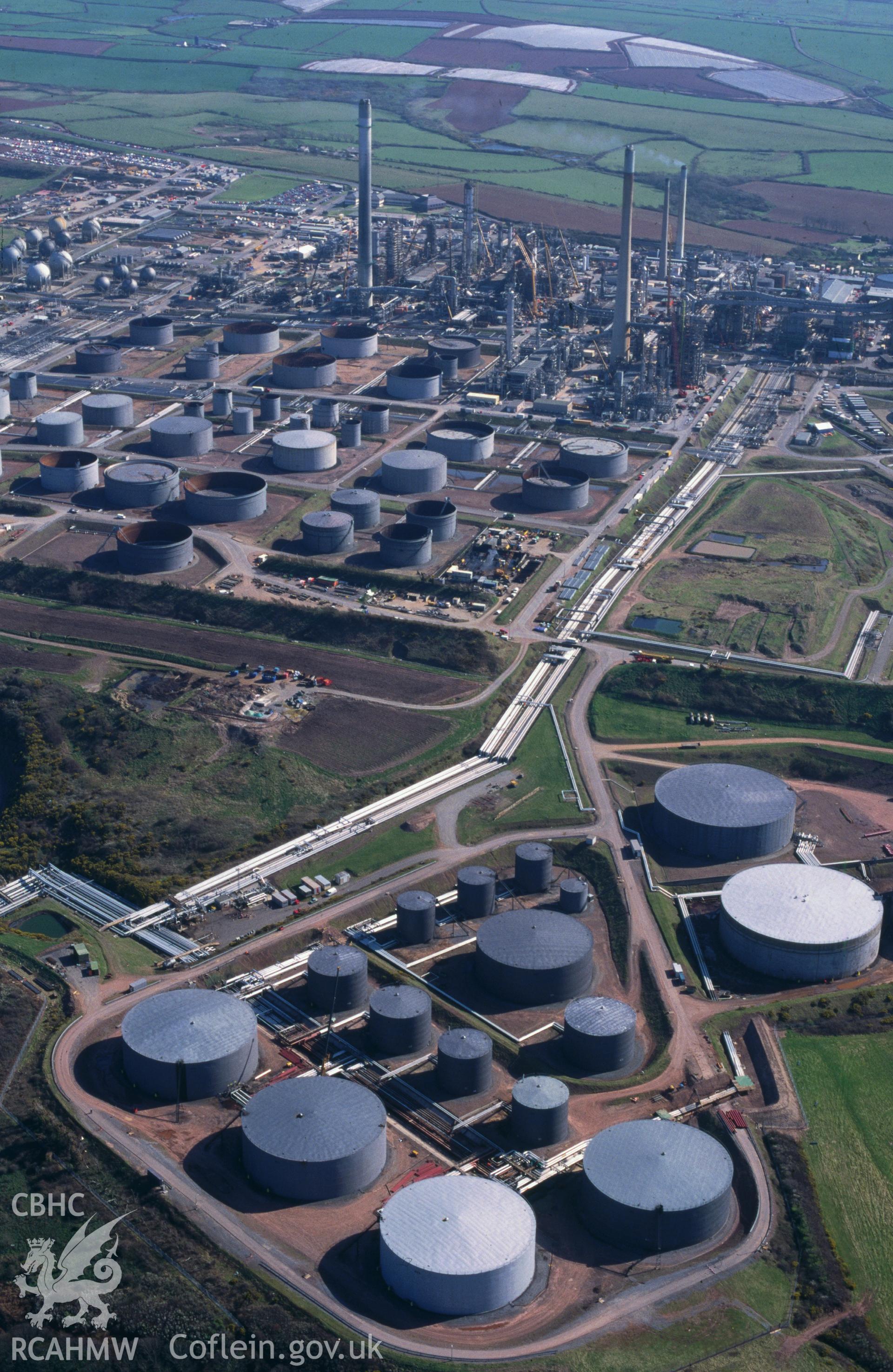 Slide of RCAHMW colour oblique aerial photograph of Rhoscrowther Oil Refinery And Storage Facility, taken by C.R. Musson, 13/4/1995.