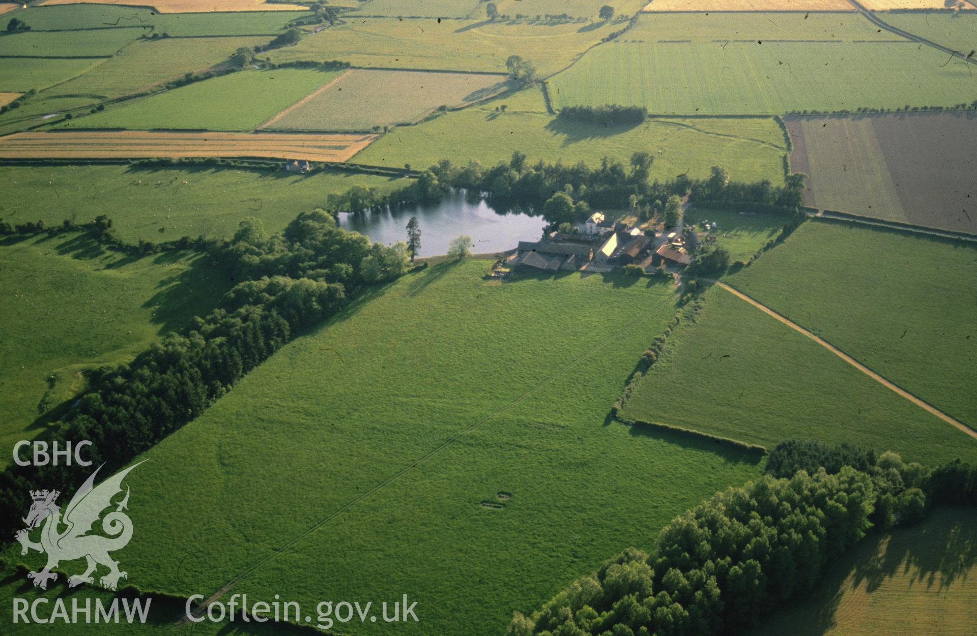 Slide of RCAHMW colour oblique aerial photograph of Hindwell Farm Fort, taken by C.R. Musson, 13/6/1988.