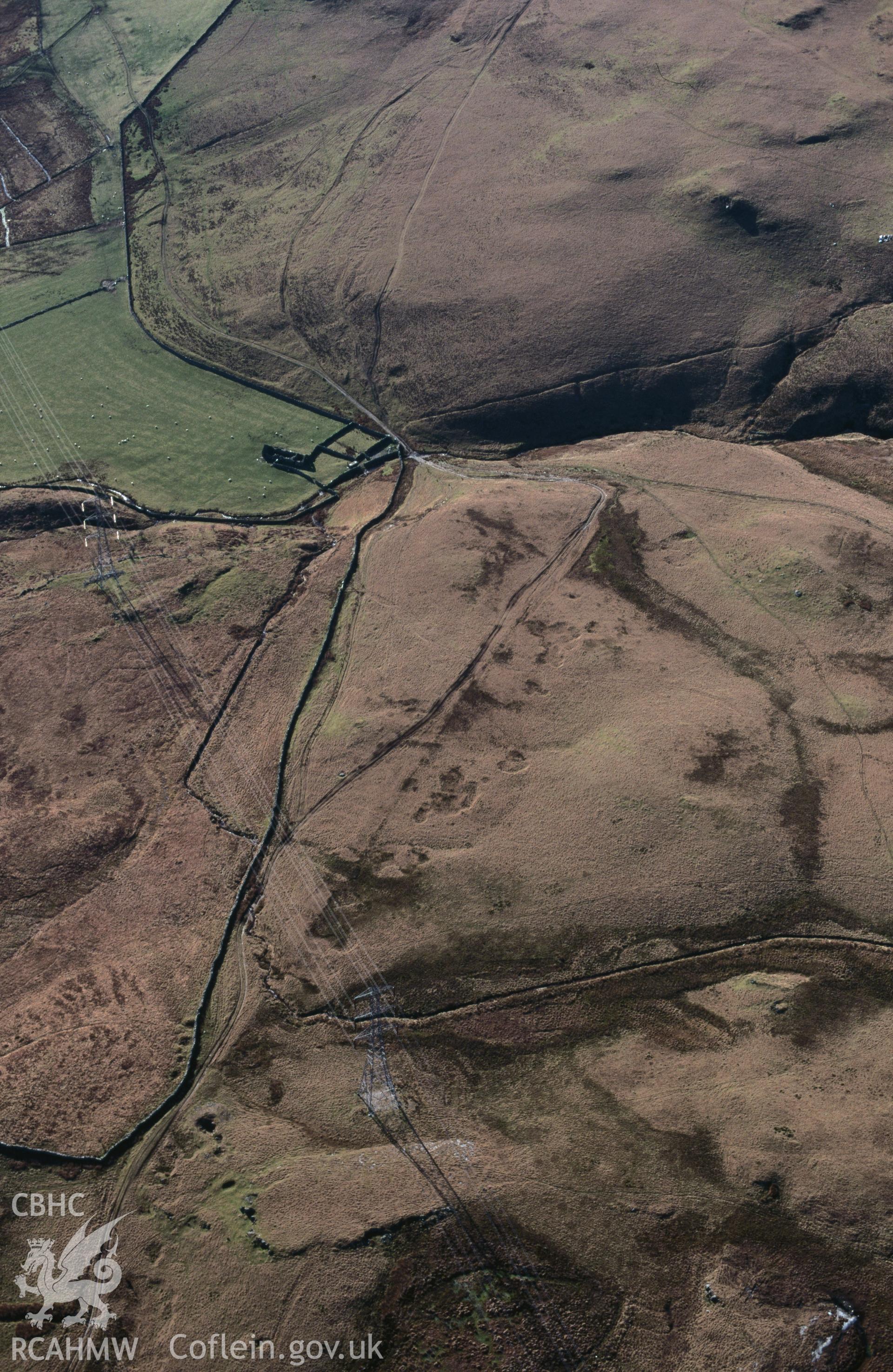 RCAHMW colour slide oblique aerial photograph of possible stretch of Roman road WNW of Dolddinas, Trawsfynydd, taken by C.R.Musson on the 30/03/1996