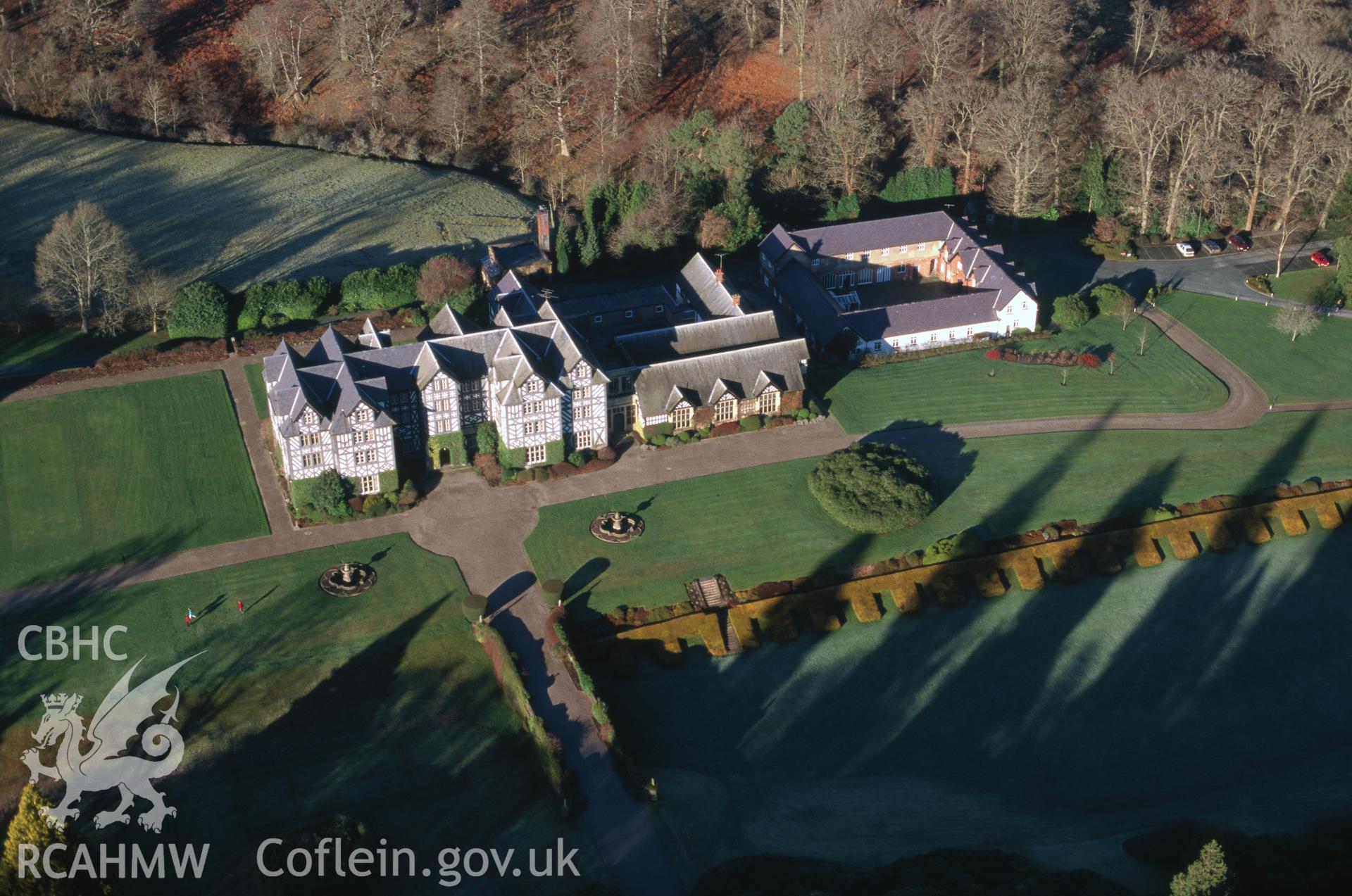 Slide of RCAHMW colour oblique aerial photograph of Gregynog Hall, taken by C.R. Musson, 20/12/1998.