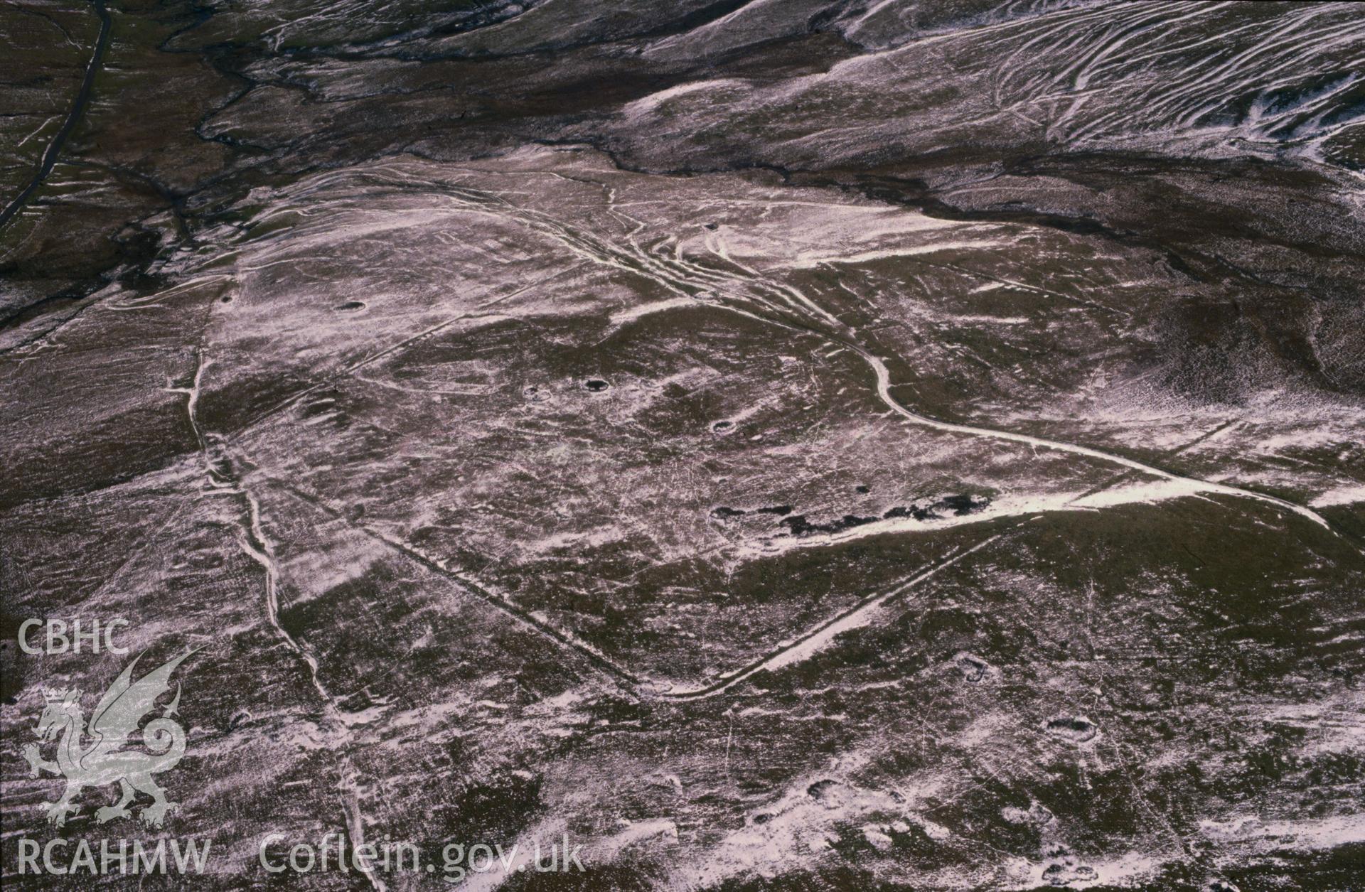 Slide of RCAHMW colour oblique aerial photograph of Esgair Perfedd Marching Camp, taken by C.R. Musson, 3/3/1900.