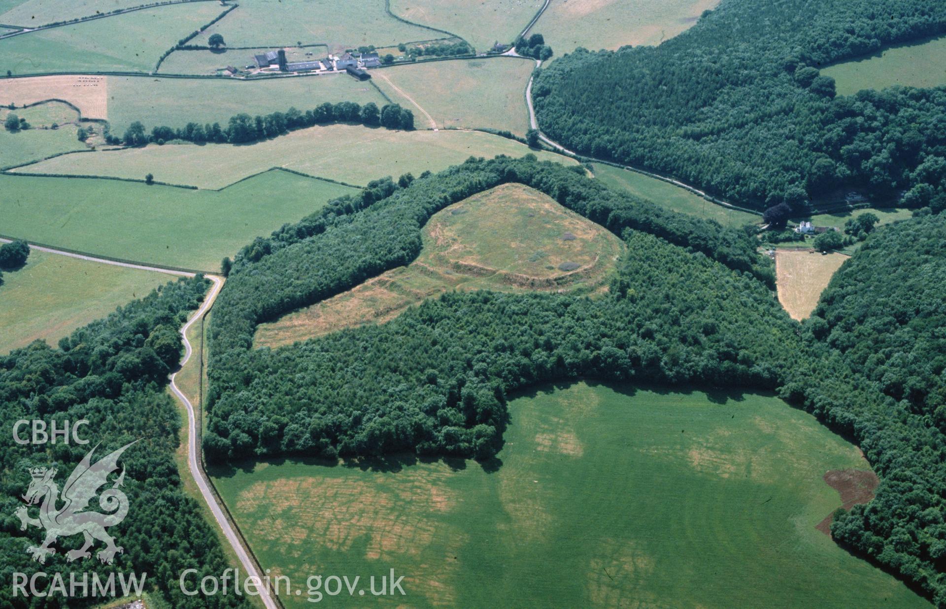 Slide of RCAHMW colour oblique aerial photograph of Llanmelin Camp, taken by C.R. Musson, 29/6/1989.