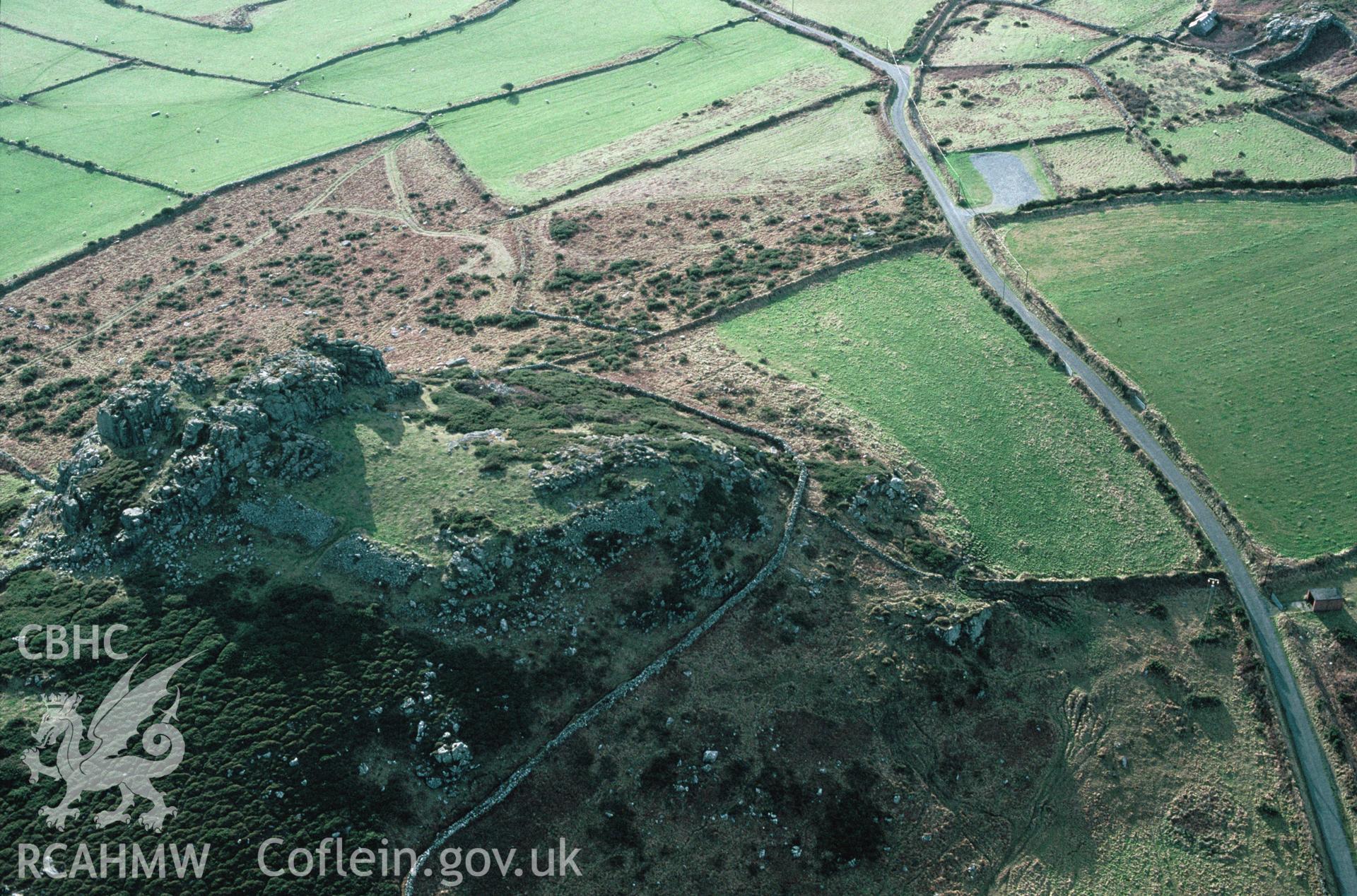 RCAHMW colour slide oblique aerial photograph of Garn Fechan Camp, Pencaer, taken by C.R. Musson, 16/01/94