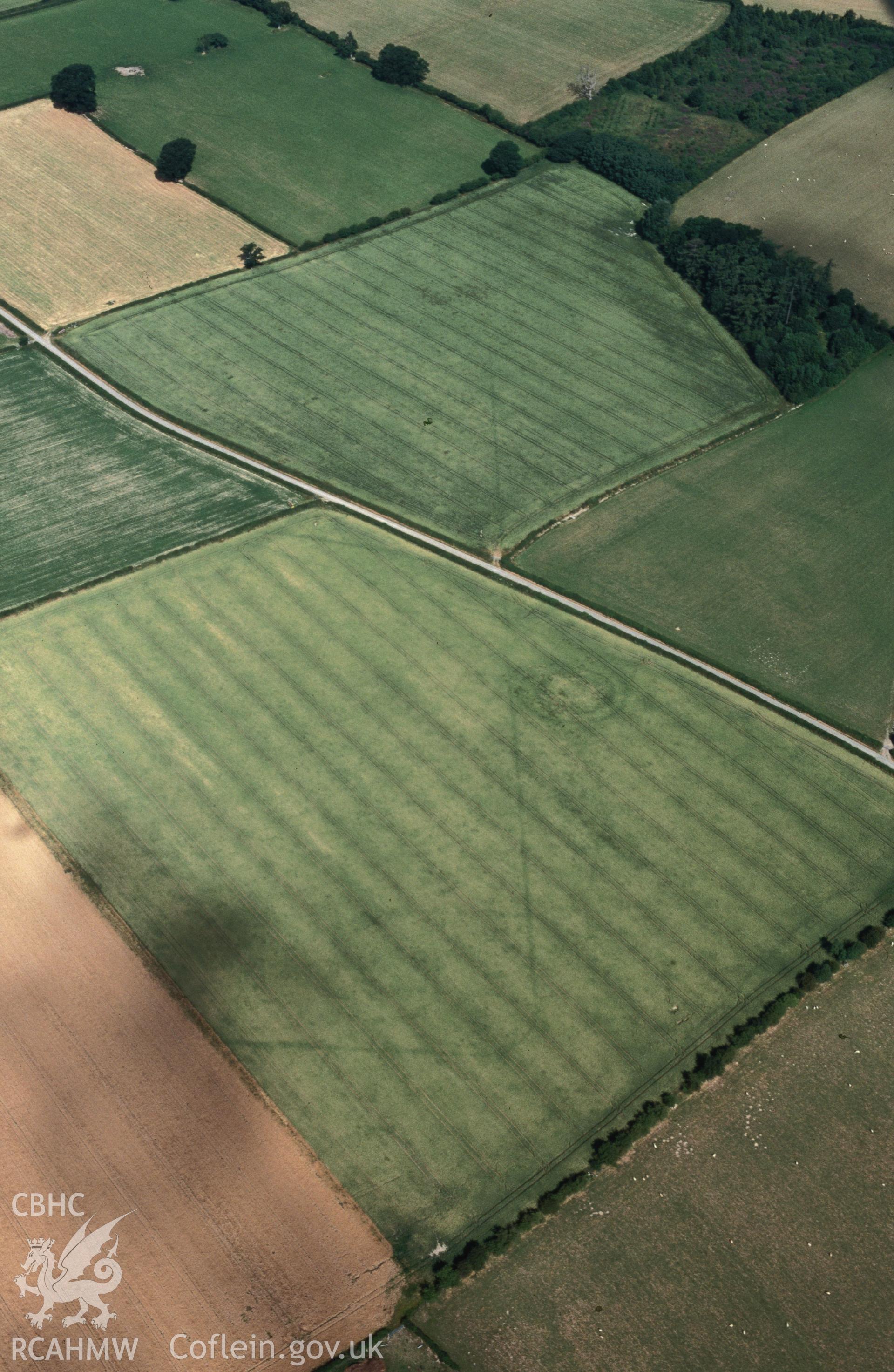 Slide of RCAHMW colour oblique aerial photograph of Hindwell Marching Camp, taken by C.R. Musson, 24/7/1996.