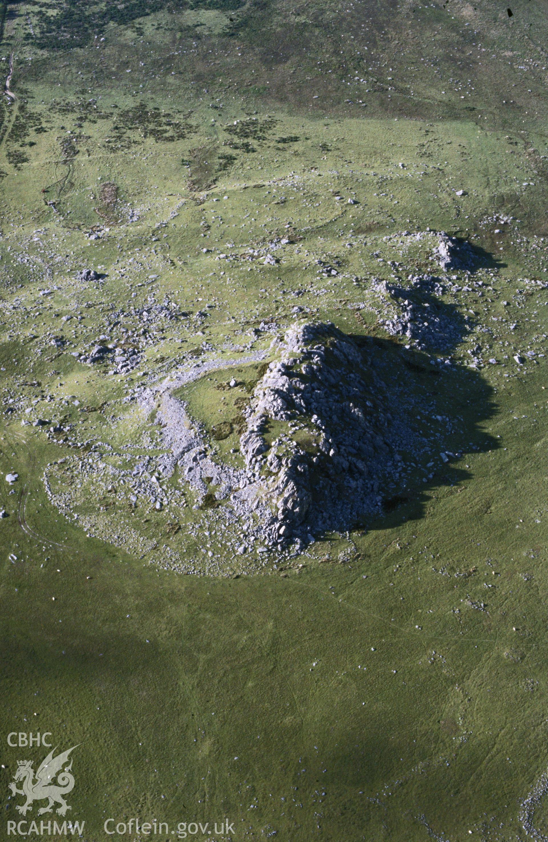 Slide of RCAHMW colour oblique aerial photograph of Carn Alw Hillfort, taken by C.R. Musson, 2/7/1990.