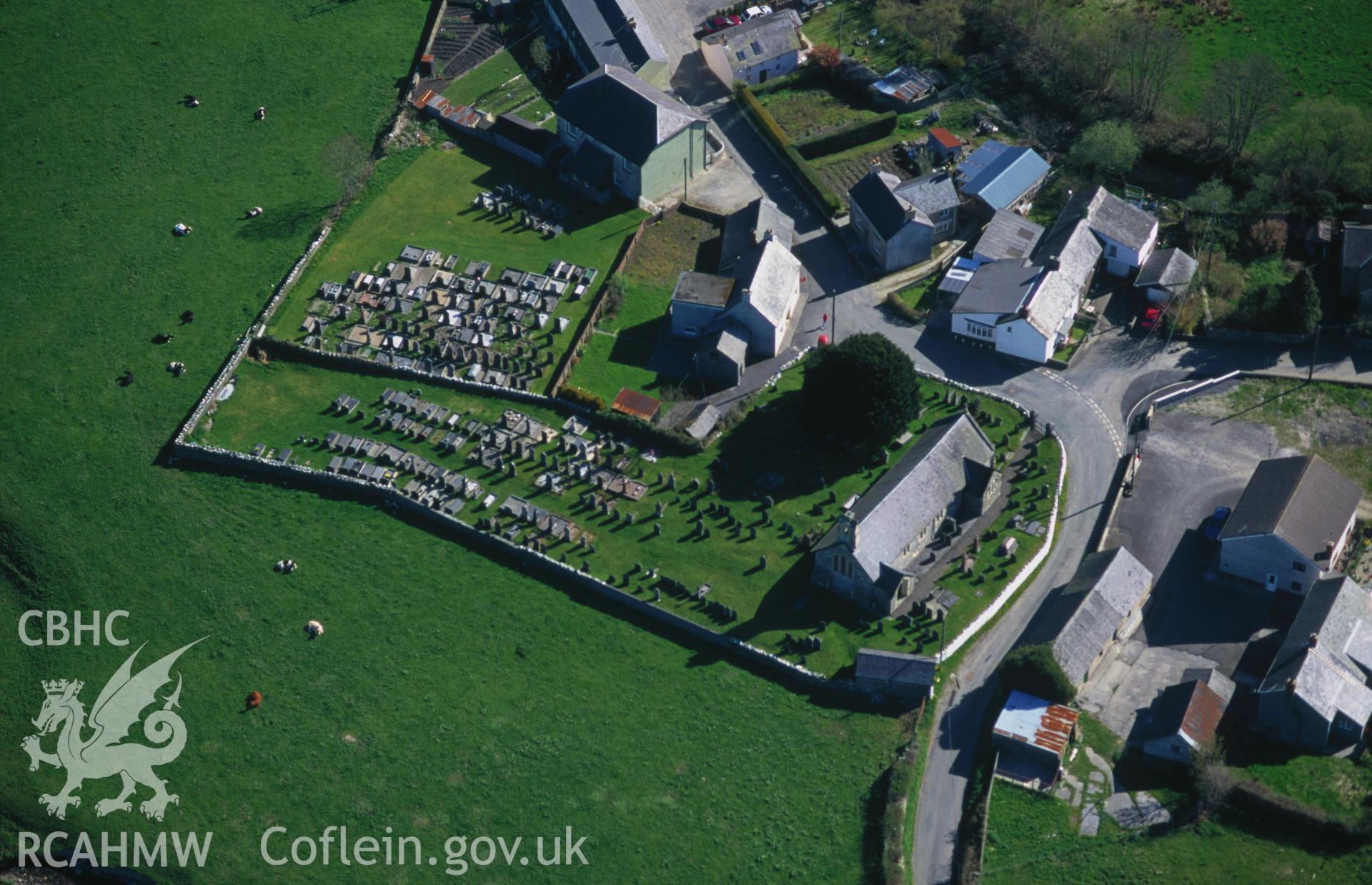 RCAHMW colour slide oblique aerial photograph of Five Saints Stone in Pumpsaint churchyard, Llanpumsaint, taken by C.R.Musson on the 04/05/1996