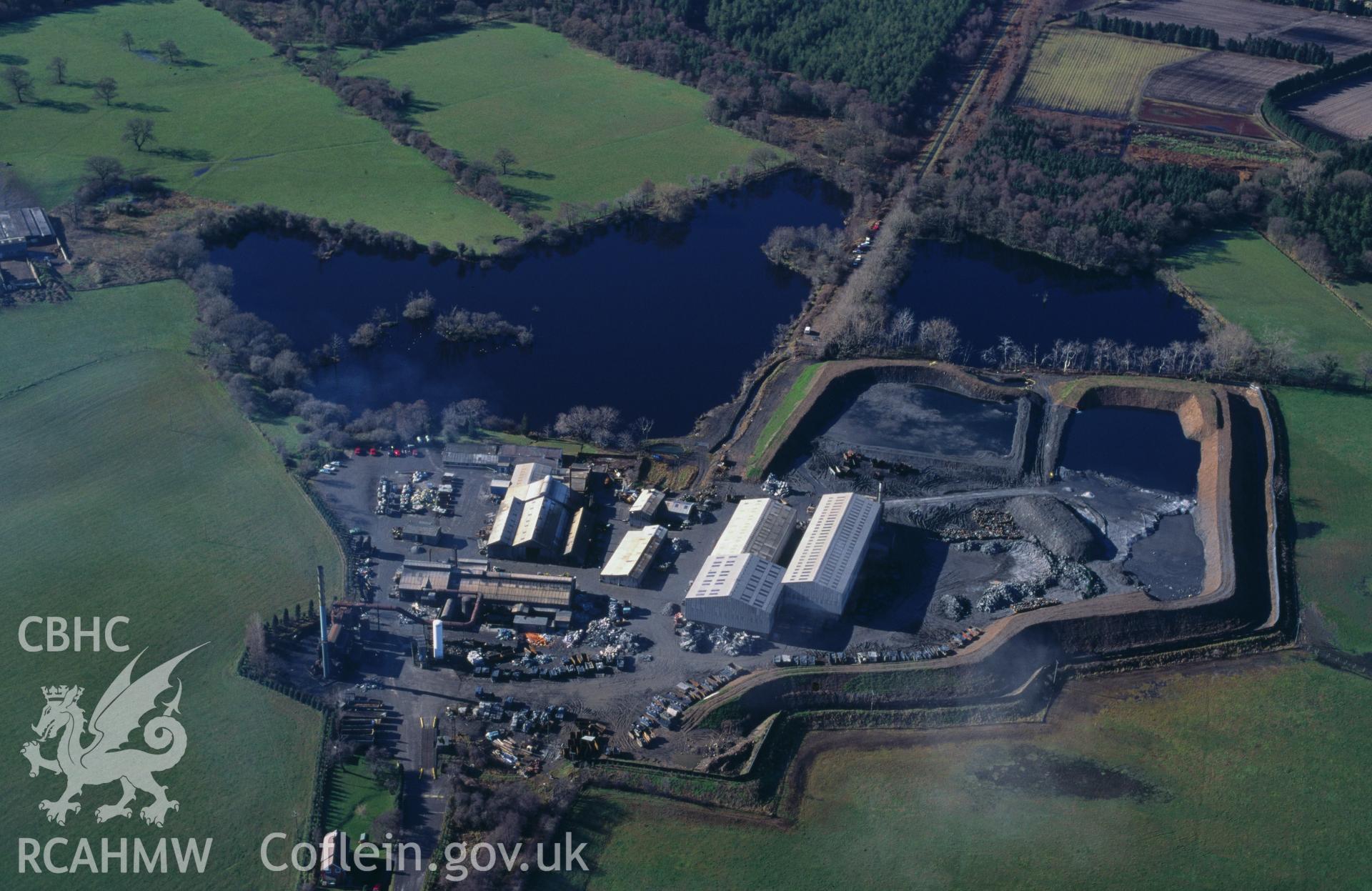 RCAHMW colour oblique aerial photograph of Fenn's bank Aluminium Processing Plant taken on 12/03/1995 by C.R. Musson