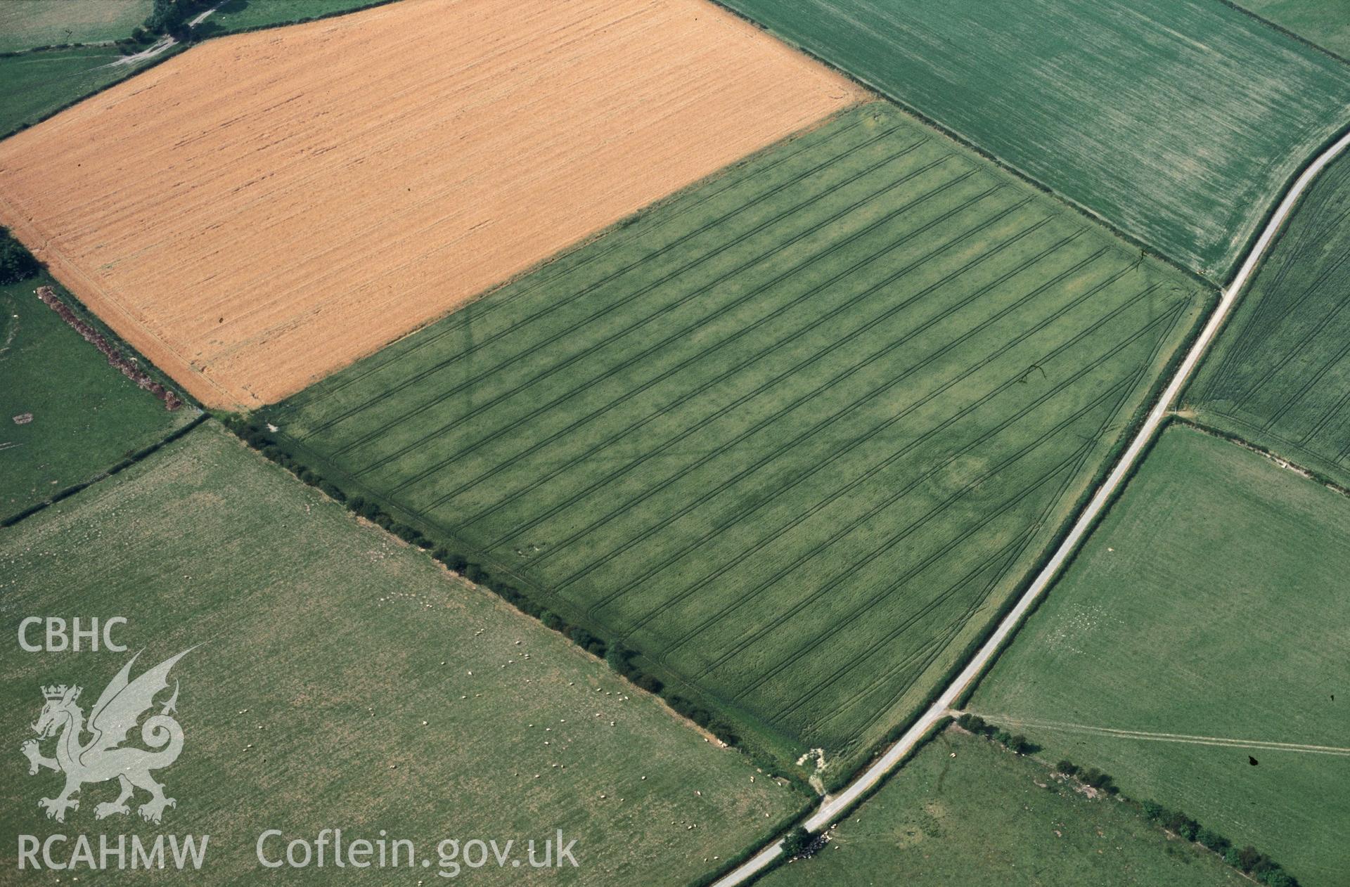 Slide of RCAHMW colour oblique aerial photograph of Hindwell Marching Camp, taken by C.R. Musson, 22/7/1996.