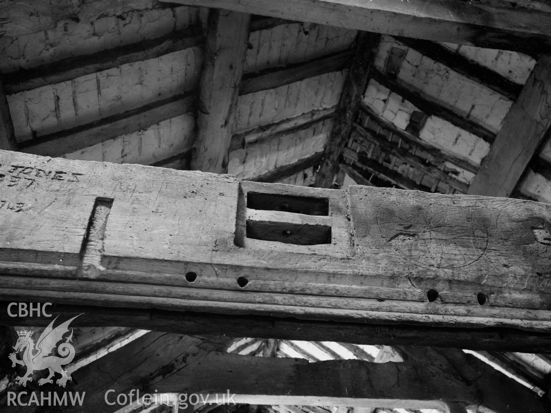 A photo inside Plas Uchaf barn, showing the timber beam supports.