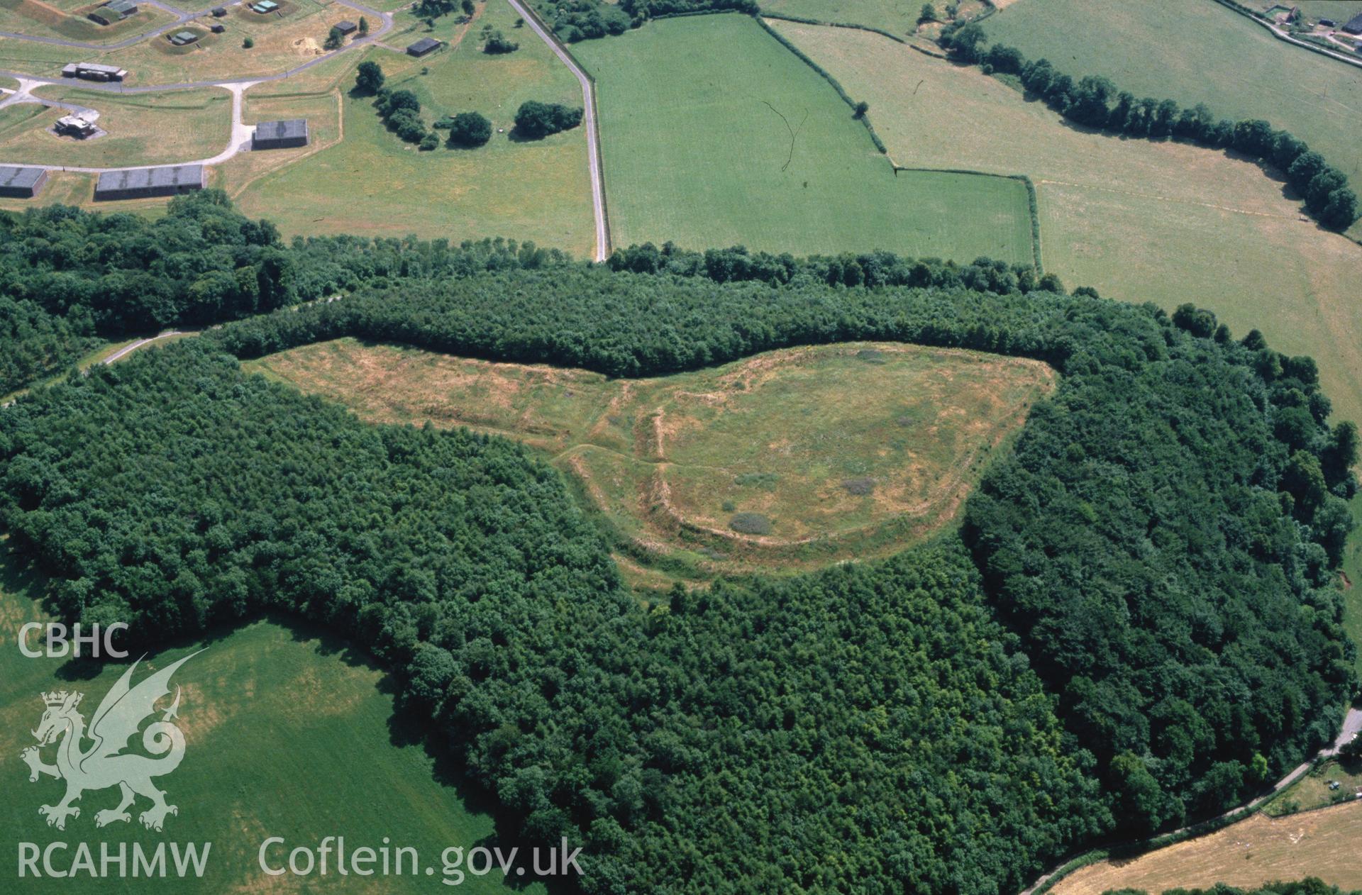 Slide of RCAHMW colour oblique aerial photograph of Llanmelin Camp, taken by C.R. Musson, 29/6/1989.