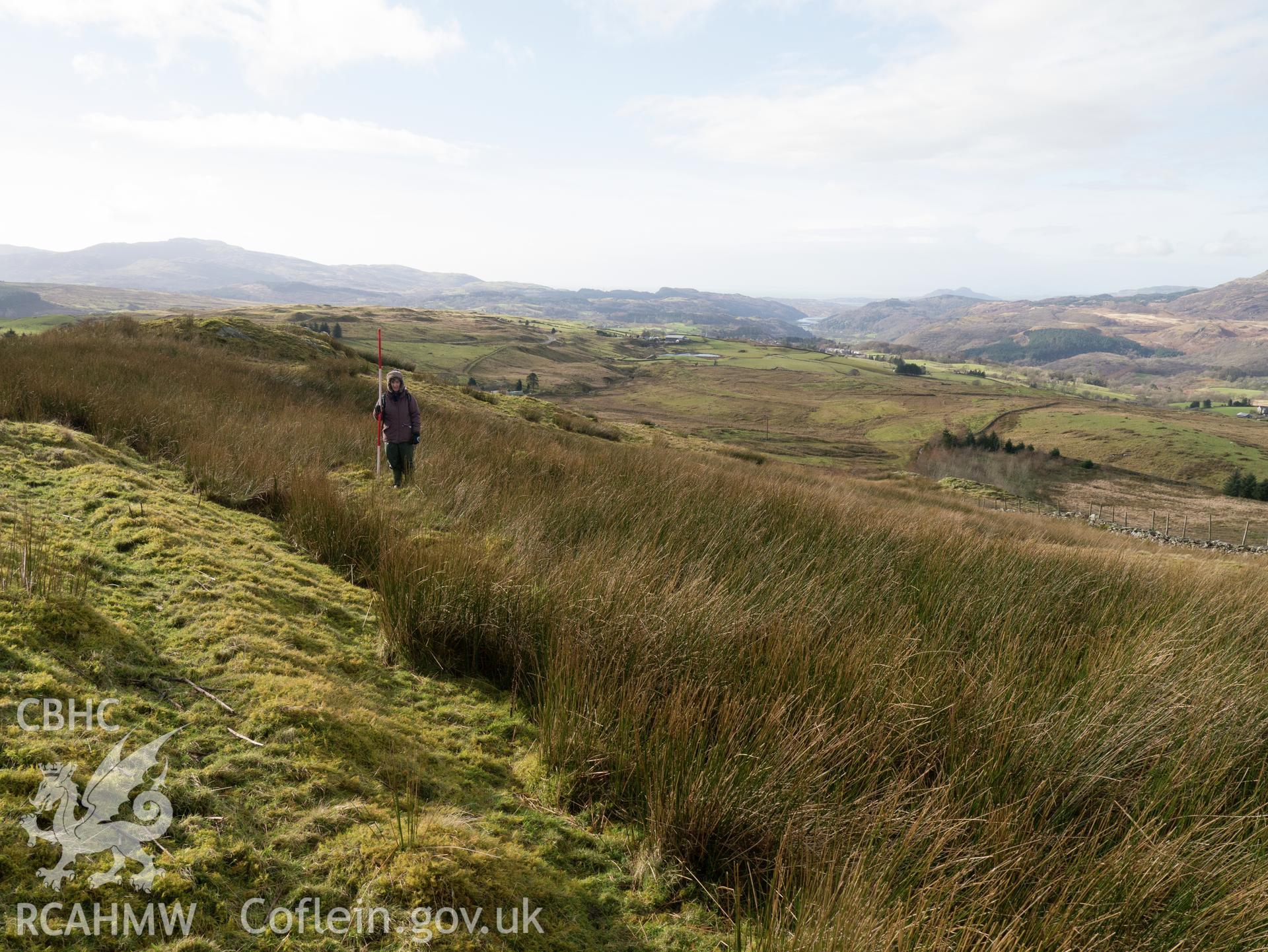 view looking SW of well-preserved section to W of Bryn y Castell.