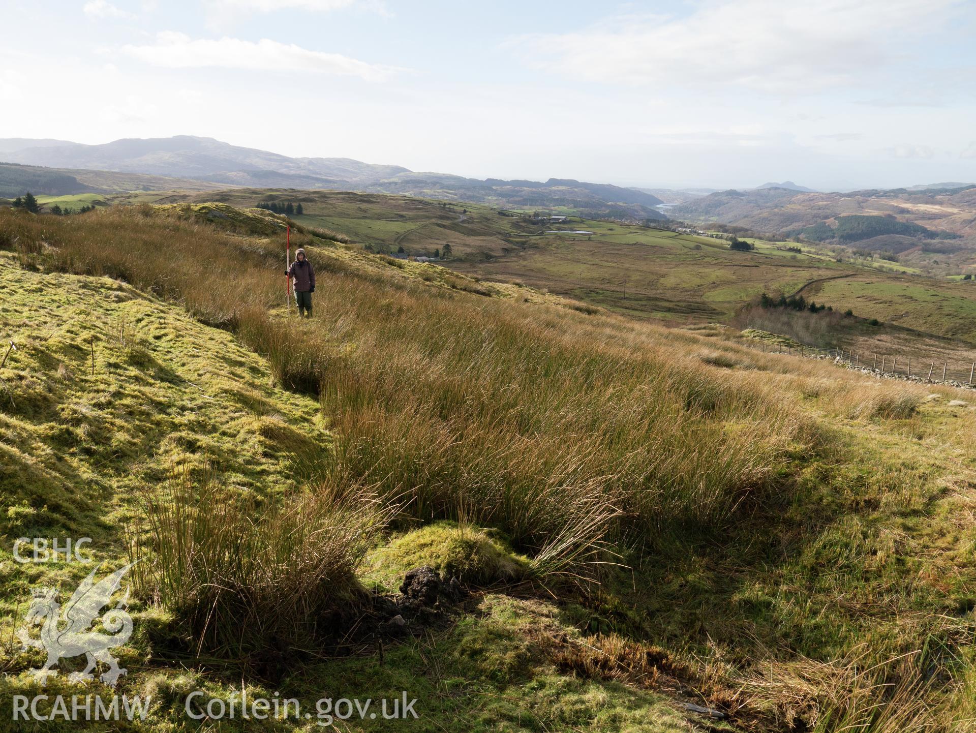 view looking SW of well-preserved section to W of Bryn y Castell.