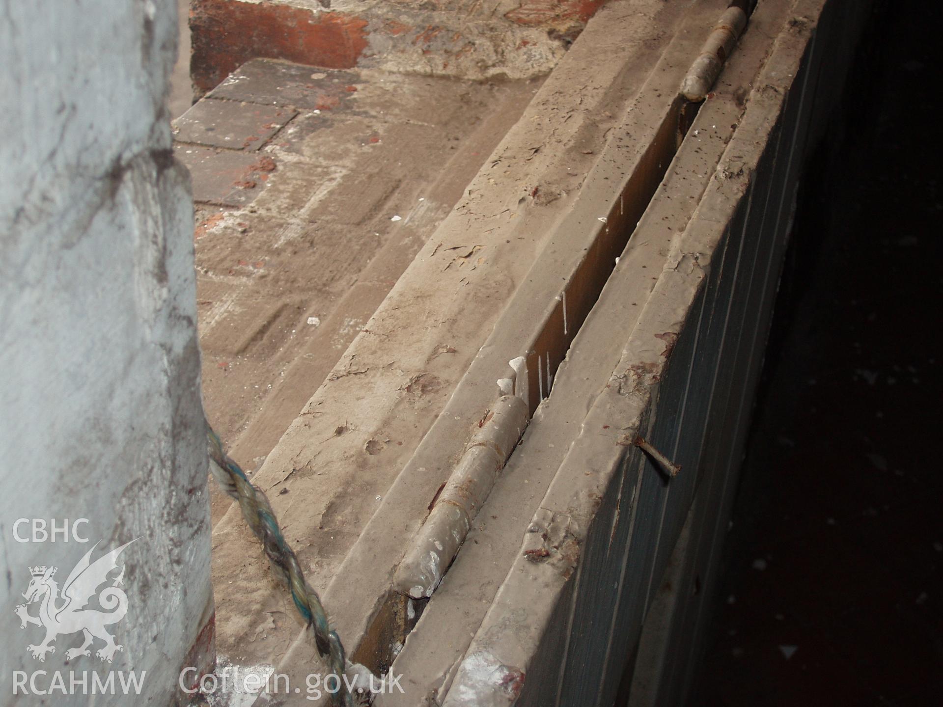 Colour digital photograph showing a hatch, used to cover a barred window at the Malt House, East Dock Road, Newport.  The photograph was taken after the Malt House was severely damaged by fire.