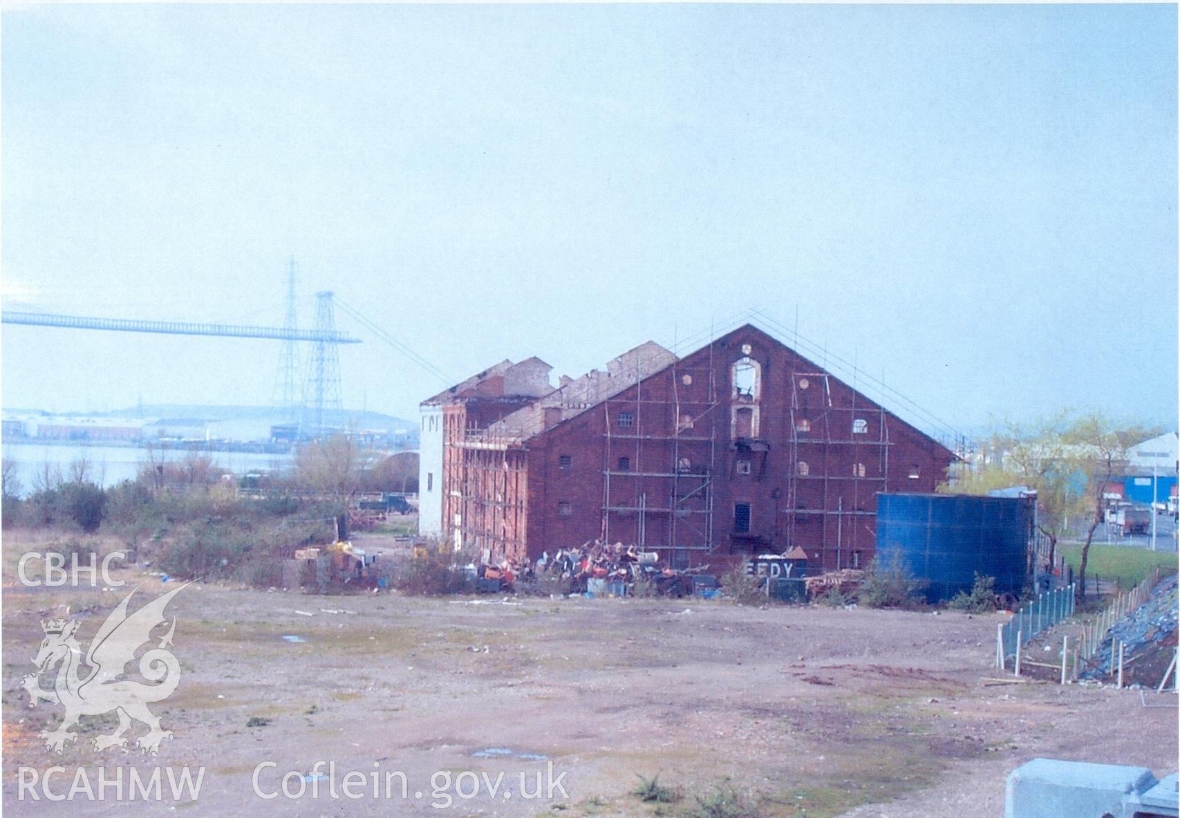 Colour scan of a photograph showing the exterior of the Malt House, East Dock Road, Newport. The photograph was taken after a fire severely damaged the building.