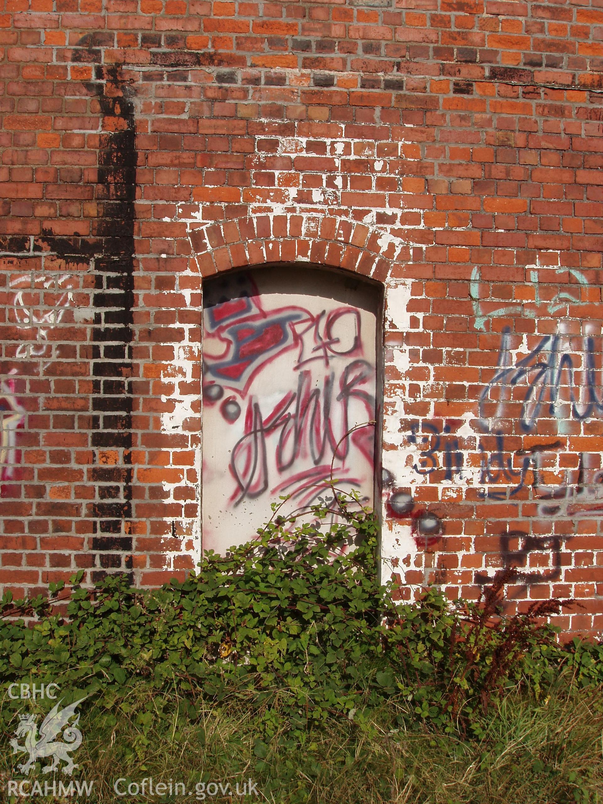 Colour digital photograph showing part of an exterior wall of the Malt House, East Dock Road, Newport.  The photograph was taken after the Malt House was severely damaged by fire.