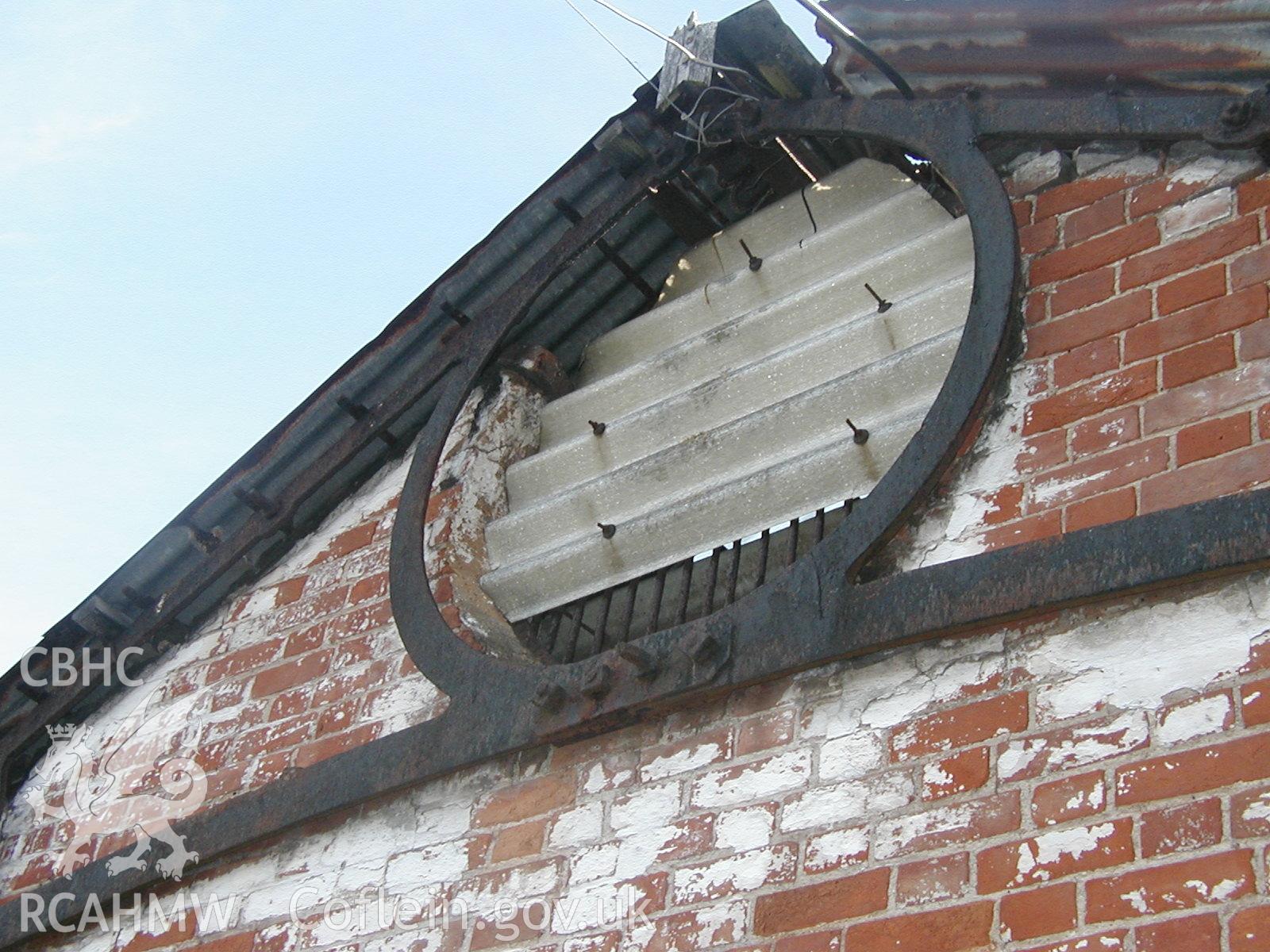 Digital colour photograph showing detail of the central porthole in the Gable end of the South range of Newport Cattle Market.