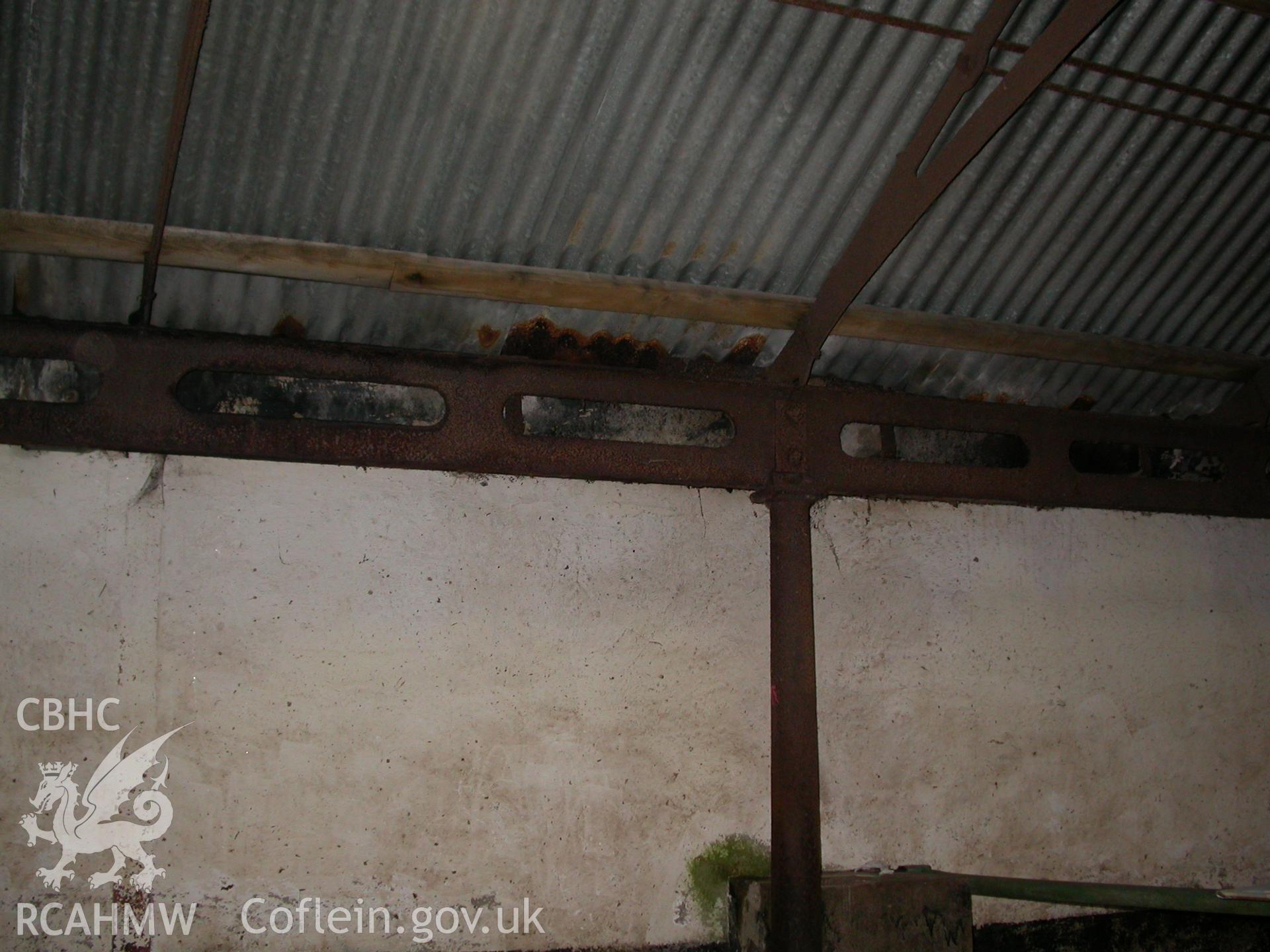 Digital colour photograph showing cast iron beams and support in the interior of the South range of Newport Cattle market.