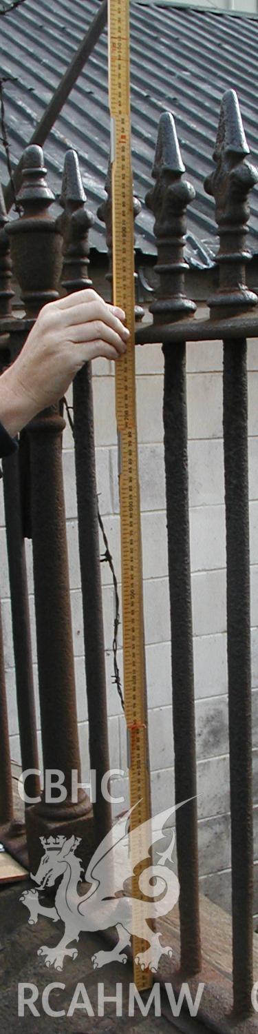 Digital colour photograph showing the railings on the North Side of Newport Cattle Market being measured.