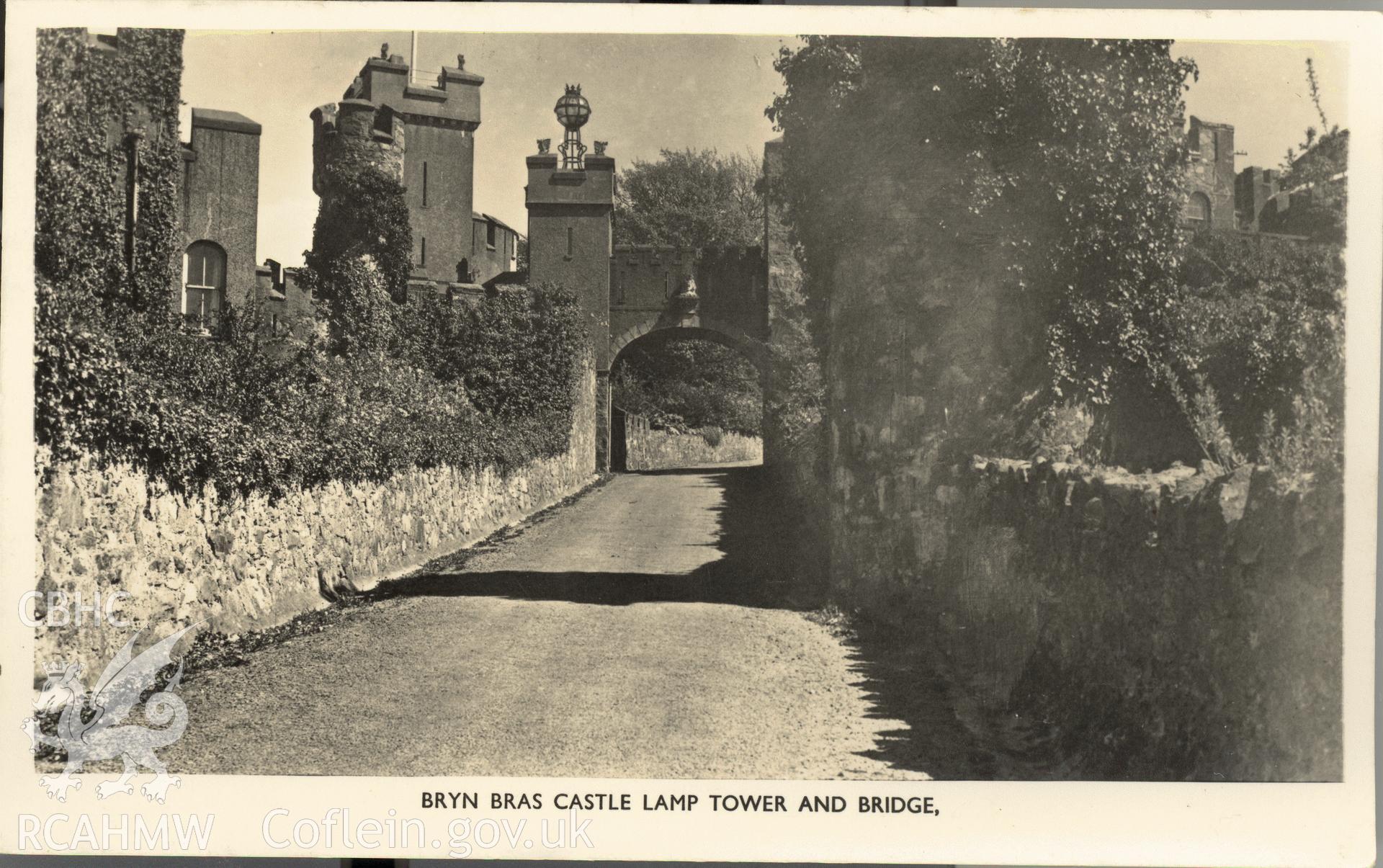 Digitised postcard image of Bryn Bras Castle, Llanrug, with Lamp Tower and Bridge. Produced by Parks and Gardens Data Services, from an original item in the Peter Davis Collection at Parks and Gardens UK. We hold only web-resolution images of this collection, suitable for viewing on screen and for research purposes only. We do not hold the original images, or publication quality scans.