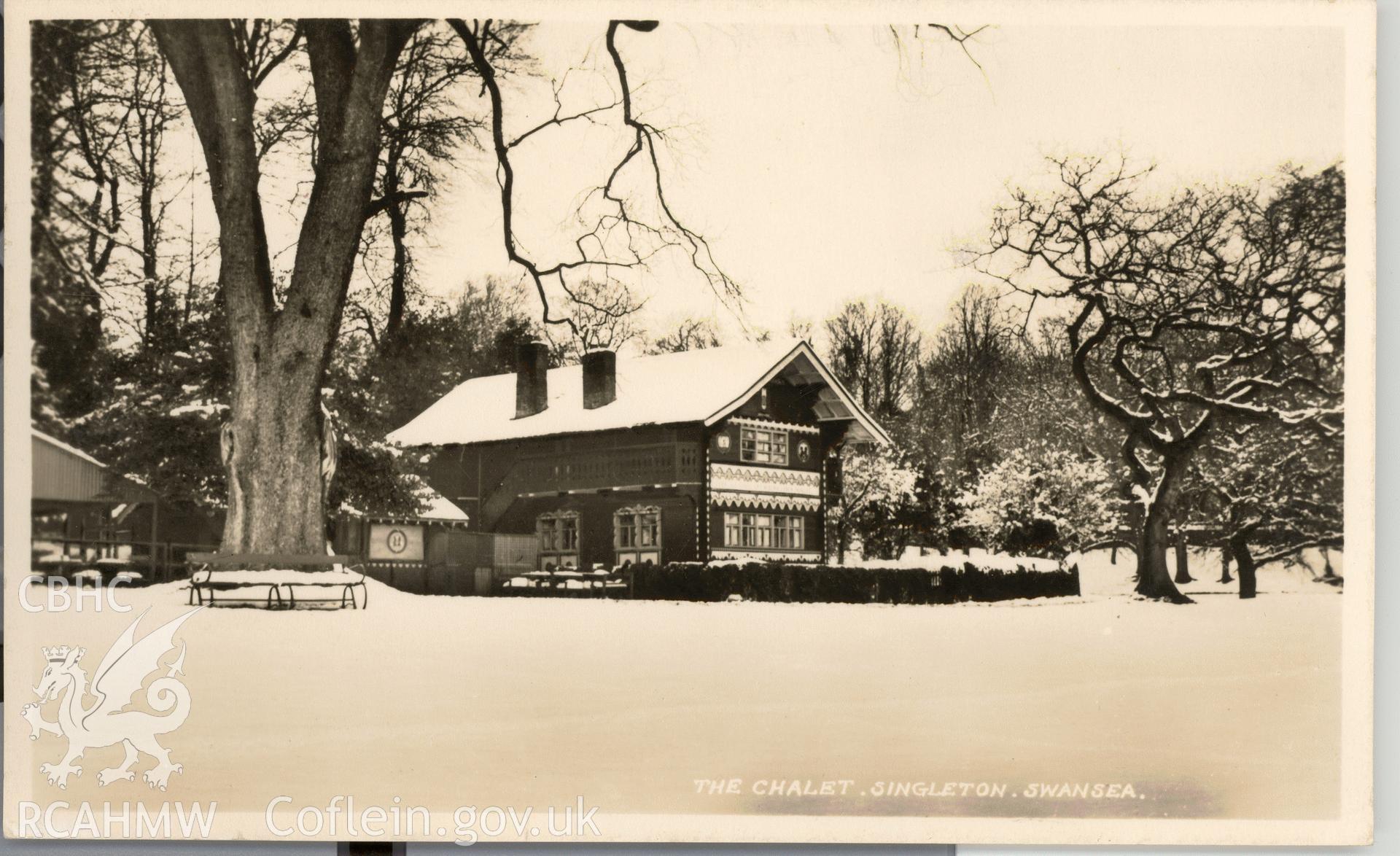 Digitised postcard image of the Swiss cottage, Singleton Park, Swansea, in snow. Produced by Parks and Gardens Data Services, from an original item in the Peter Davis Collection at Parks and Gardens UK. We hold only web-resolution images of this collection, suitable for viewing on screen and for research purposes only. We do not hold the original images, or publication quality scans.