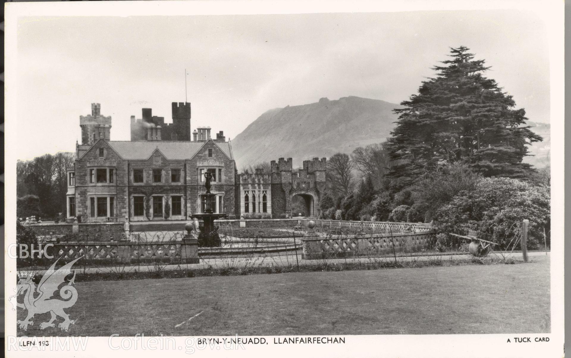 Digitised postcard image of Bryn-y-Neuadd, Llanfairfechan, with fountain, Raphael Tuck and Sons Ltd. Produced by Parks and Gardens Data Services, from an original item in the Peter Davis Collection at Parks and Gardens UK. We hold only web-resolution images of this collection, suitable for viewing on screen and for research purposes only. We do not hold the original images, or publication quality scans.