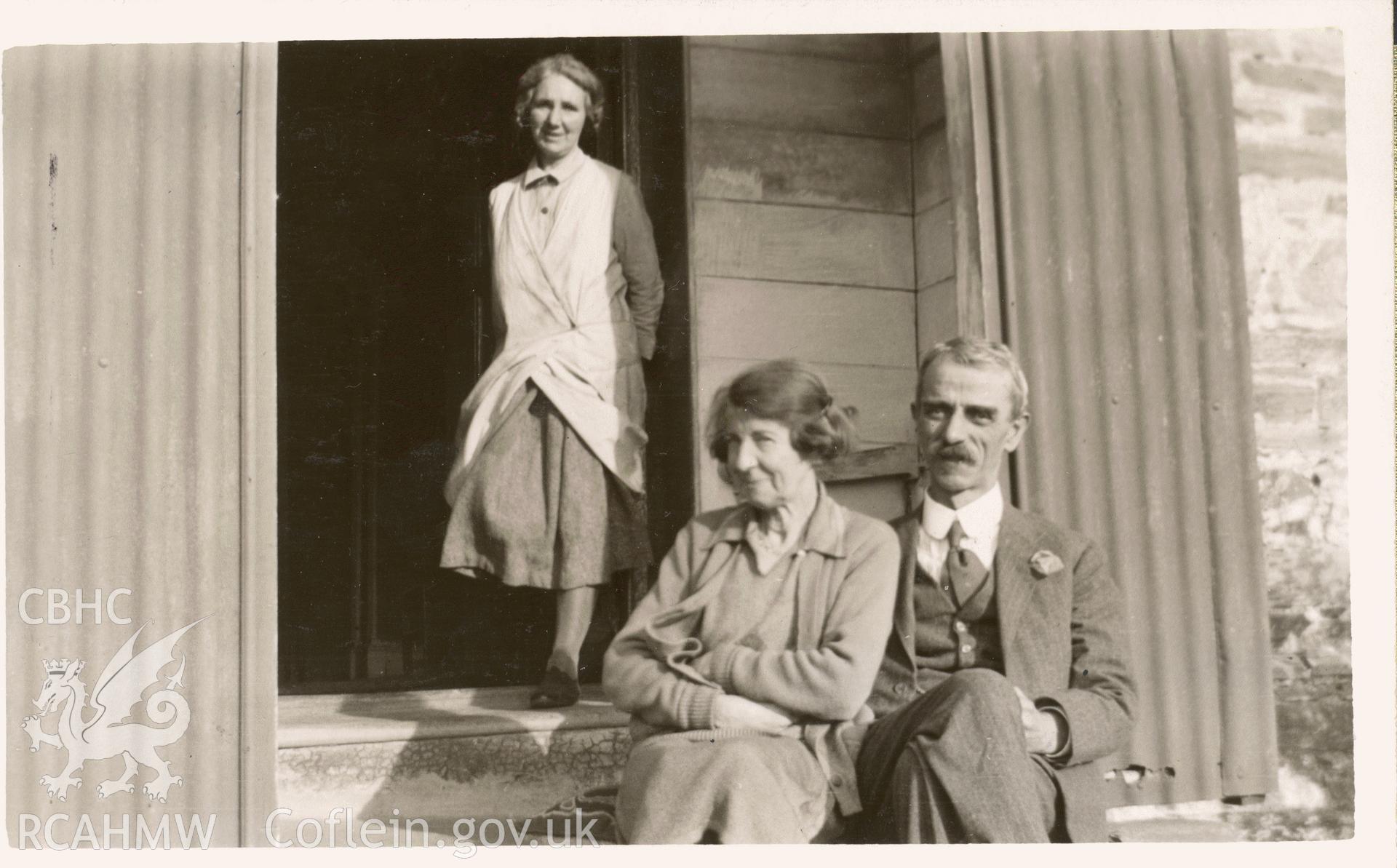 Digitised postcard image of owners on front steps, Bryn-y-Mor, Cardigan. Produced by Parks and Gardens Data Services, from an original item in the Peter Davis Collection at Parks and Gardens UK. We hold only web-resolution images of this collection, suitable for viewing on screen and for research purposes only. We do not hold the original images, or publication quality scans.