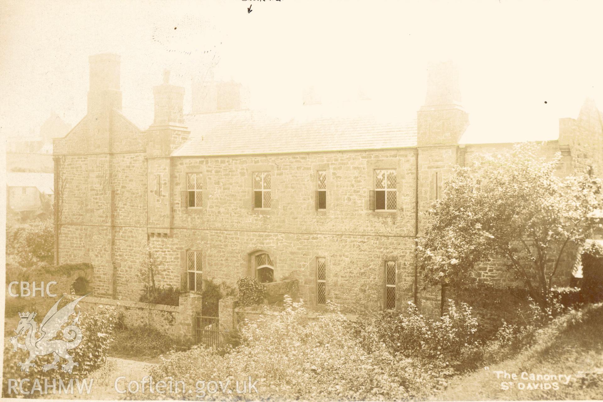 Digitised postcard image of The canonry, St David's. Produced by Parks and Gardens Data Services, from an original item in the Peter Davis Collection at Parks and Gardens UK. We hold only web-resolution images of this collection, suitable for viewing on screen and for research purposes only. We do not hold the original images, or publication quality scans.