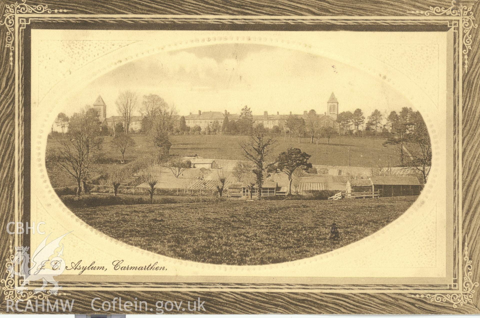 Digitised postcard image of Joint Counties Asylum, Carmarthen, with inmates' farm in foreground, Myrddin Series, published by D. Williams 19 & 20 King Street, Carmarthen. Produced by Parks and Gardens Data Services, from an original item in the Peter Davis Collection at Parks and Gardens UK. We hold only web-resolution images of this collection, suitable for viewing on screen and for research purposes only. We do not hold the original images, or publication quality scans.