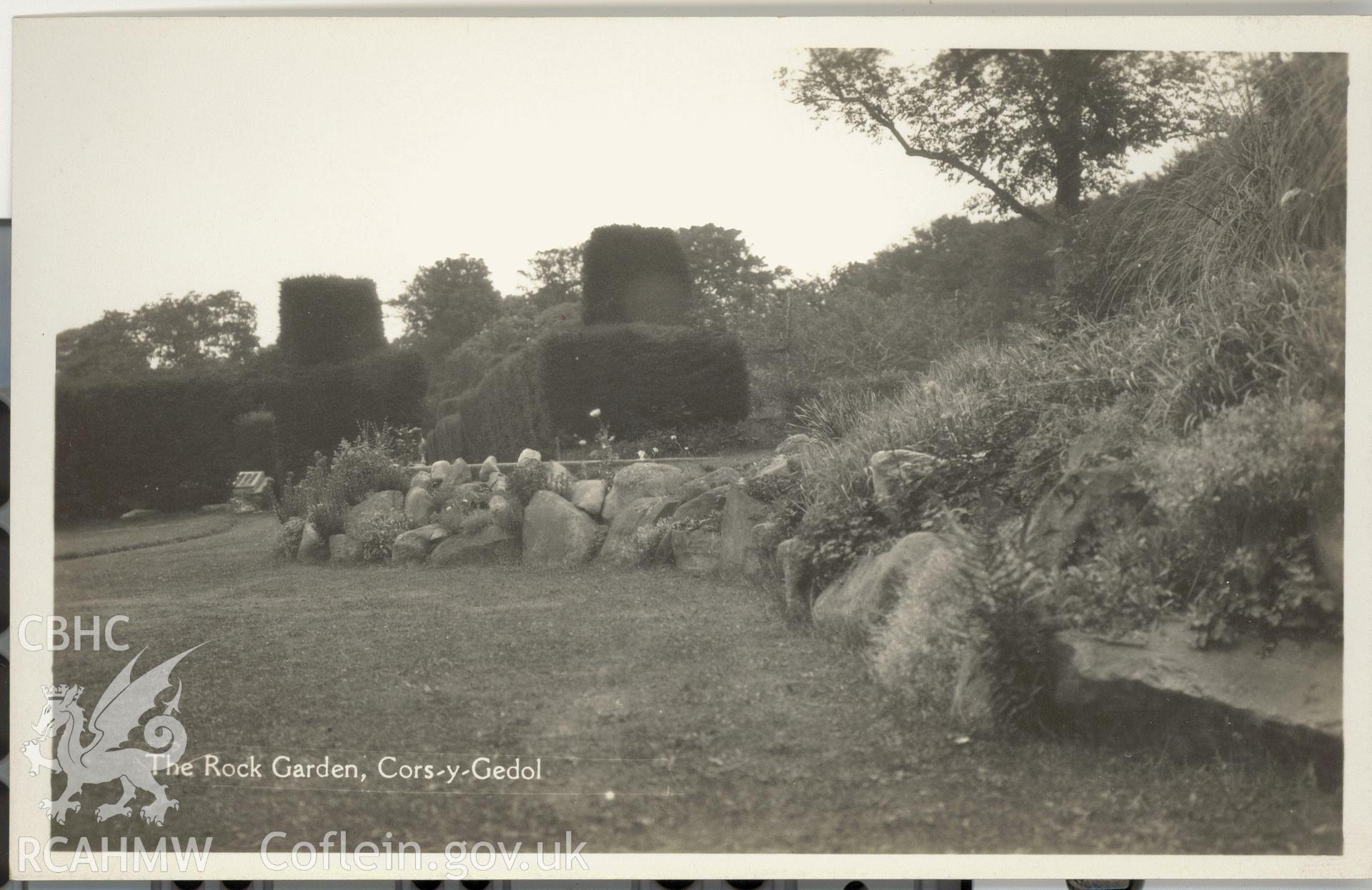 Digitised postcard image of Cors-y-Gedol gardens, showing rock garden. Produced by Parks and Gardens Data Services, from an original item in the Peter Davis Collection at Parks and Gardens UK. We hold only web-resolution images of this collection, suitable for viewing on screen and for research purposes only. We do not hold the original images, or publication quality scans.