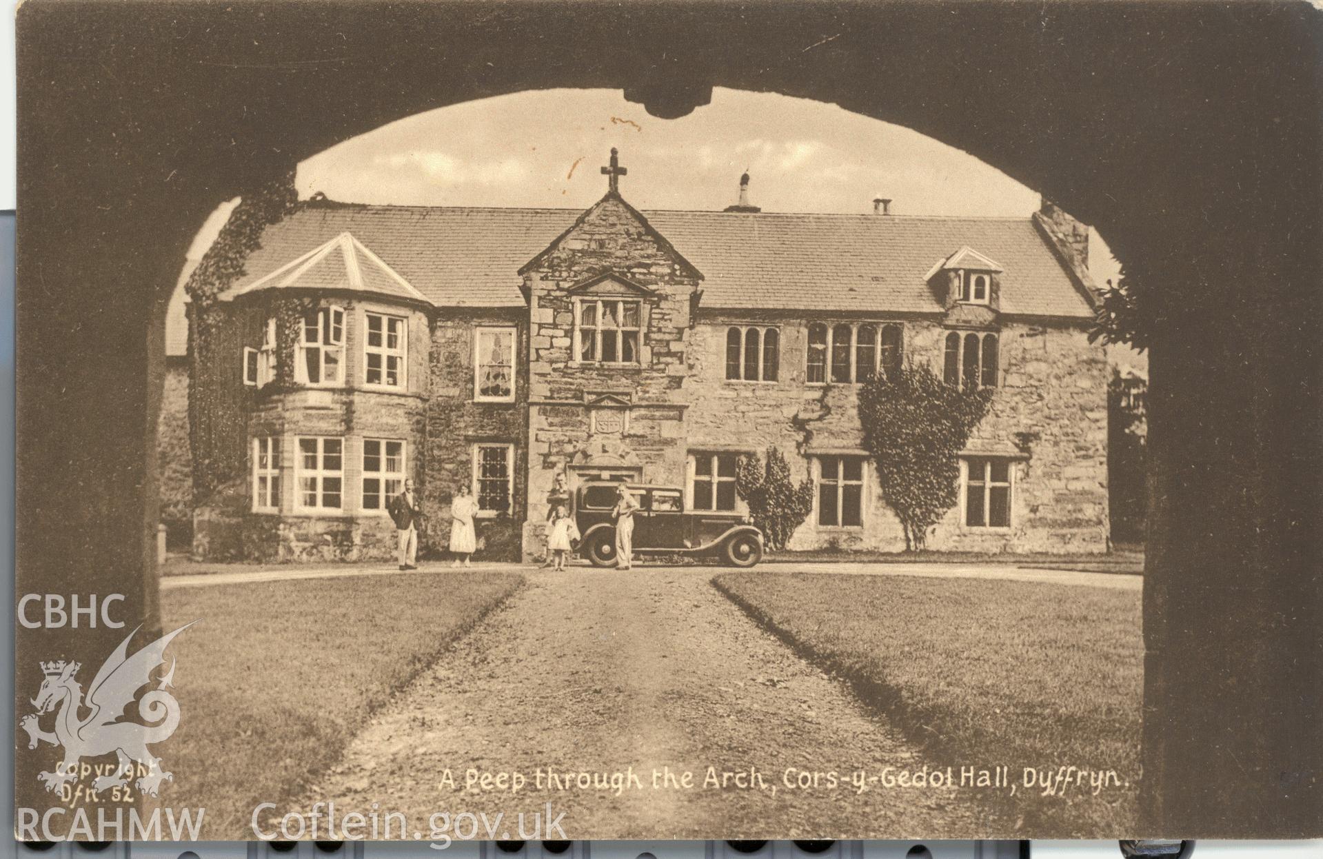 Digitised postcard image of Cors-y-Gedol Hall with figures, Lilywhite (1932) Ltd. Produced by Parks and Gardens Data Services, from an original item in the Peter Davis Collection at Parks and Gardens UK. We hold only web-resolution images of this collection, suitable for viewing on screen and for research purposes only. We do not hold the original images, or publication quality scans.