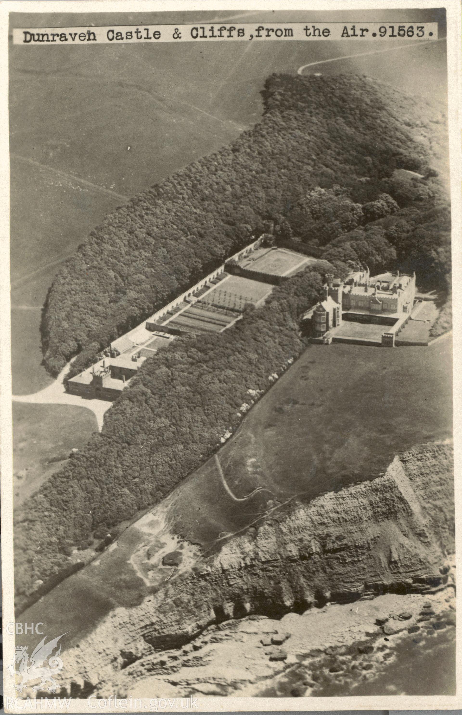 Digitised postcard image of aerial view of Dunraven Castle and bay, Aerial View by Airco Aerials Ltd. Produced by Parks and Gardens Data Services, from an original item in the Peter Davis Collection at Parks and Gardens UK. We hold only web-resolution images of this collection, suitable for viewing on screen and for research purposes only. We do not hold the original images, or publication quality scans.