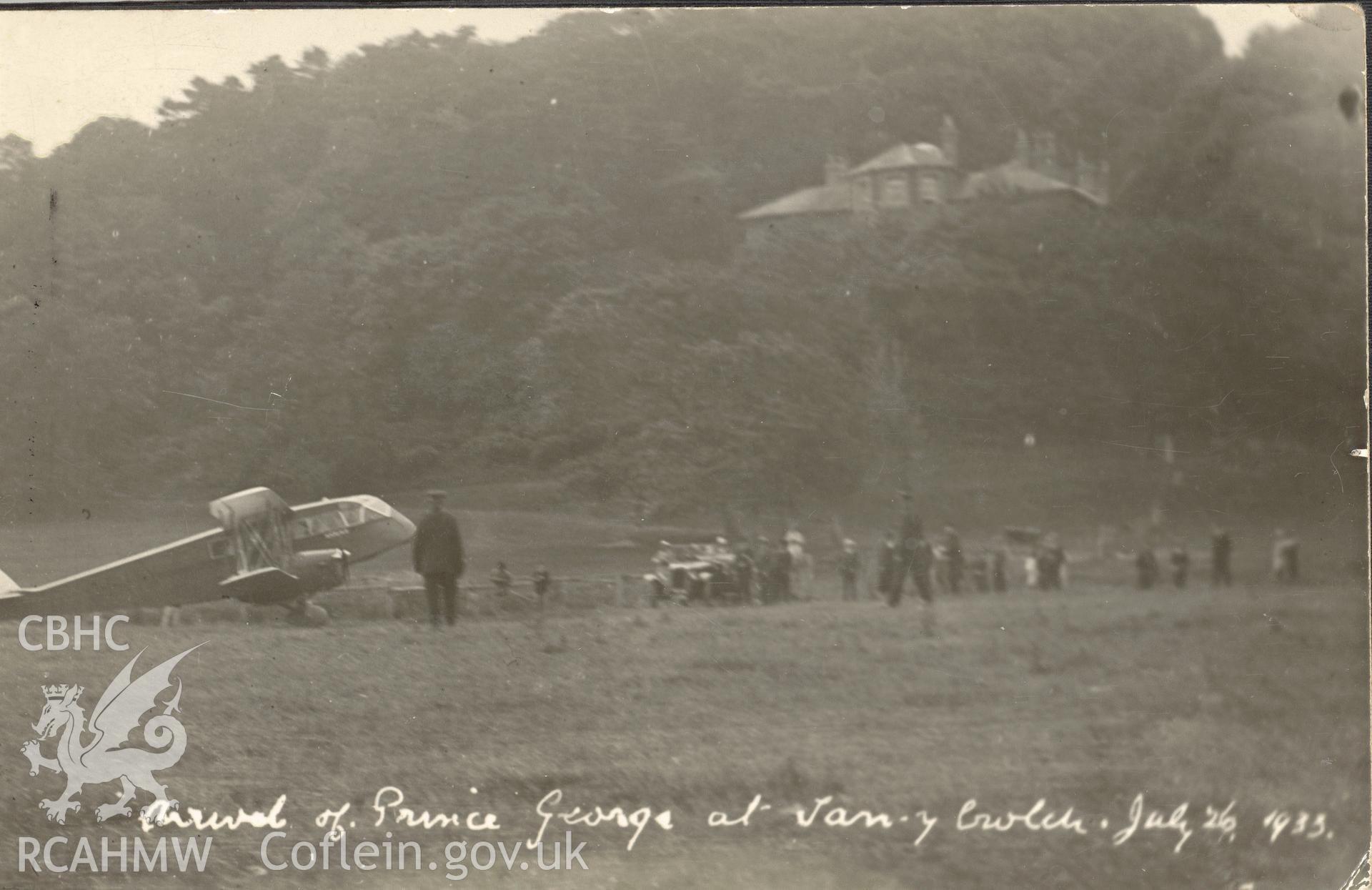 Digitised postcard image of the arrival by plane of Prince George at Plas Tanybwlch in 1933, A.J. Lewis, Photo, Aberystwyth. Produced by Parks and Gardens Data Services, from an original item in the Peter Davis Collection at Parks and Gardens UK. We hold only web-resolution images of this collection, suitable for viewing on screen and for research purposes only. We do not hold the original images, or publication quality scans.