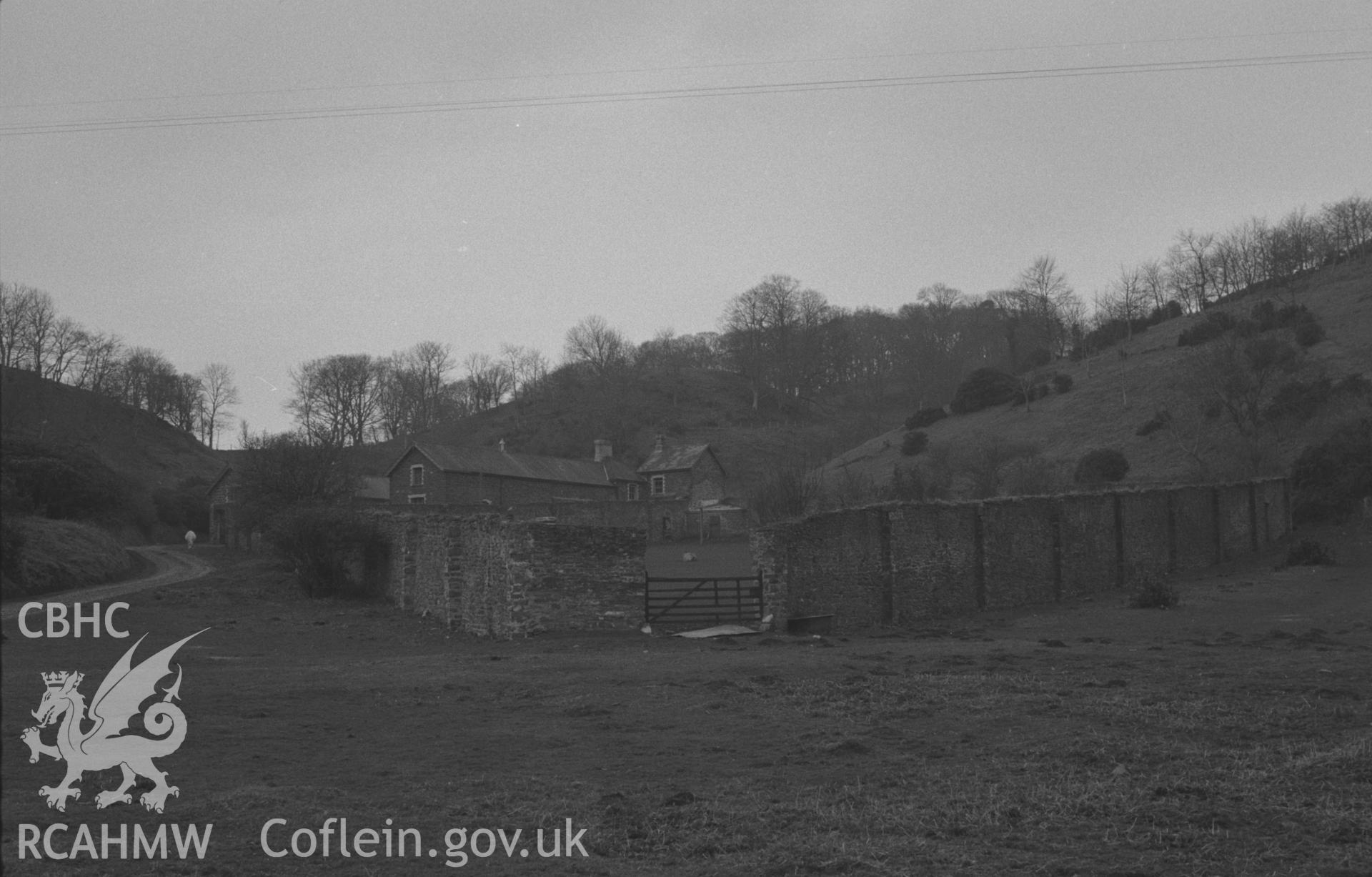 Black and White photograph showing Tanybwlch outbuildings from the drive. Photographed by Arthur Chater in April 1962 from Grid Reference SN 582 793, looking south.