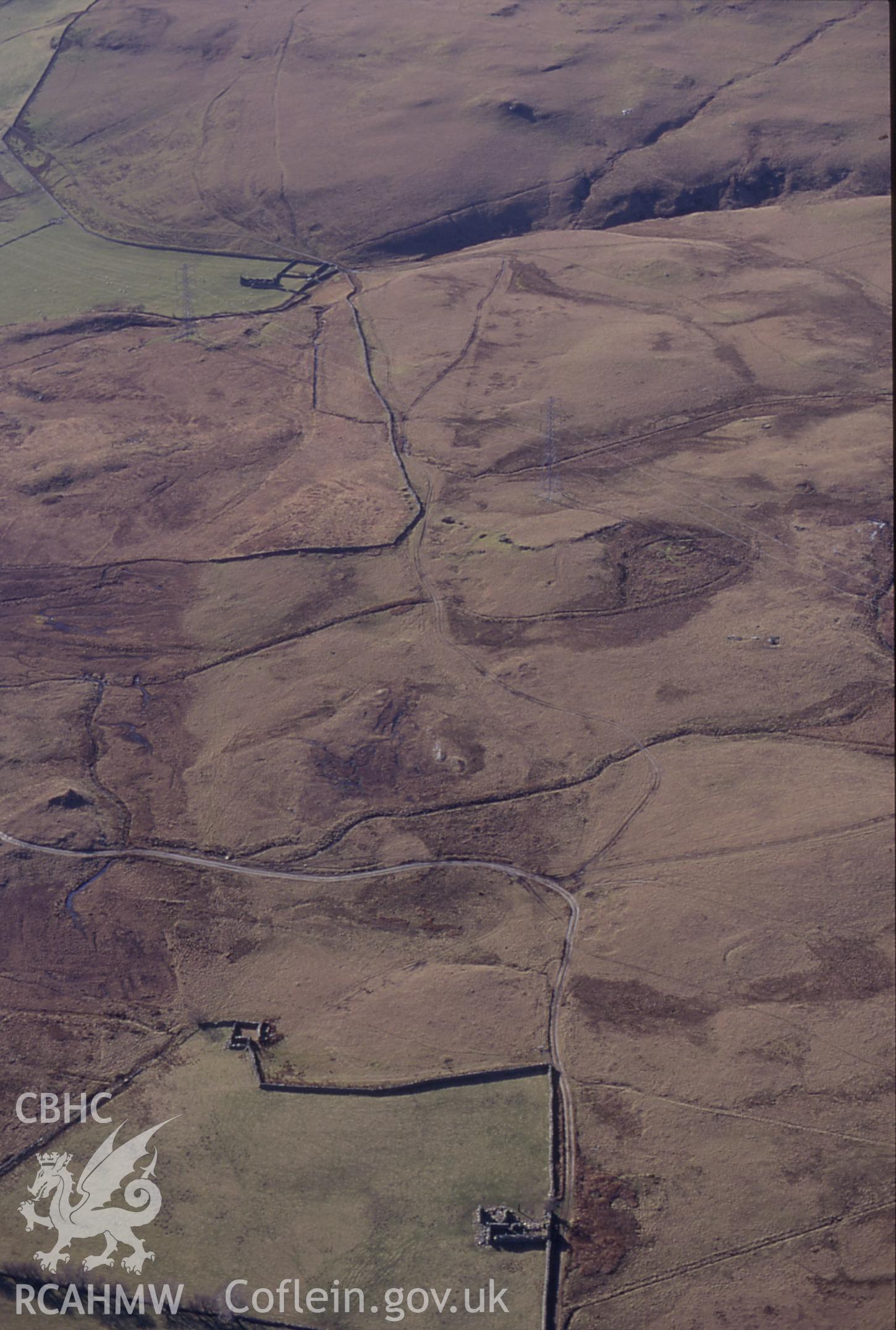 RCAHMW colour slide oblique aerial photograph of possible stretch of Roman road WNW of Dolddinas, Trawsfynydd, taken by C.R.Musson on the 30/03/1996