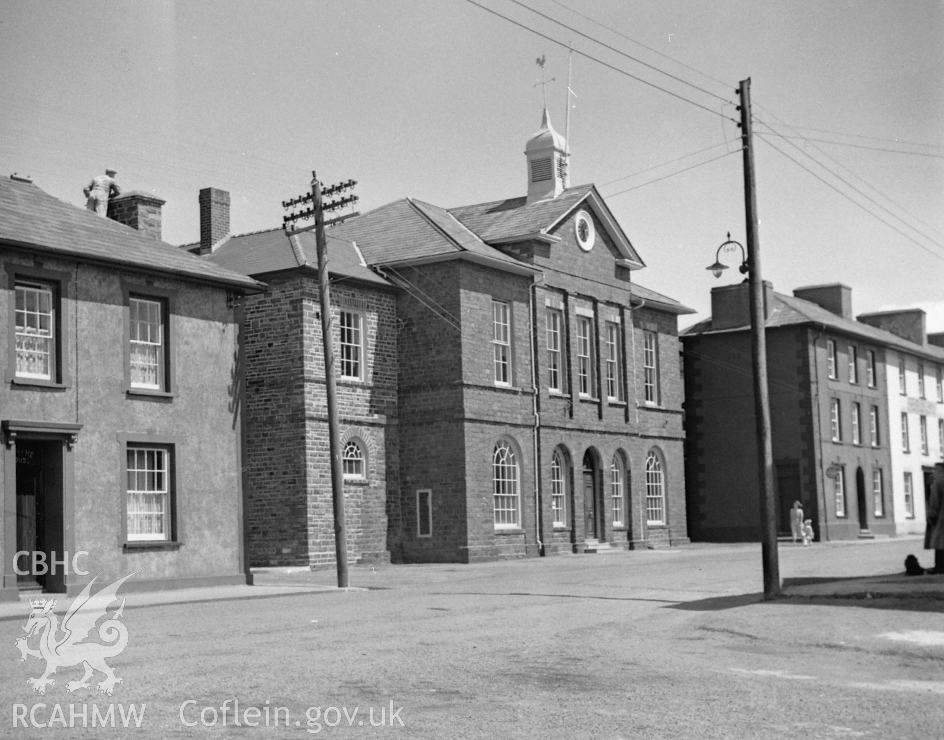 Black and white copy print of Town Hall, Aberaeron. Negative held.