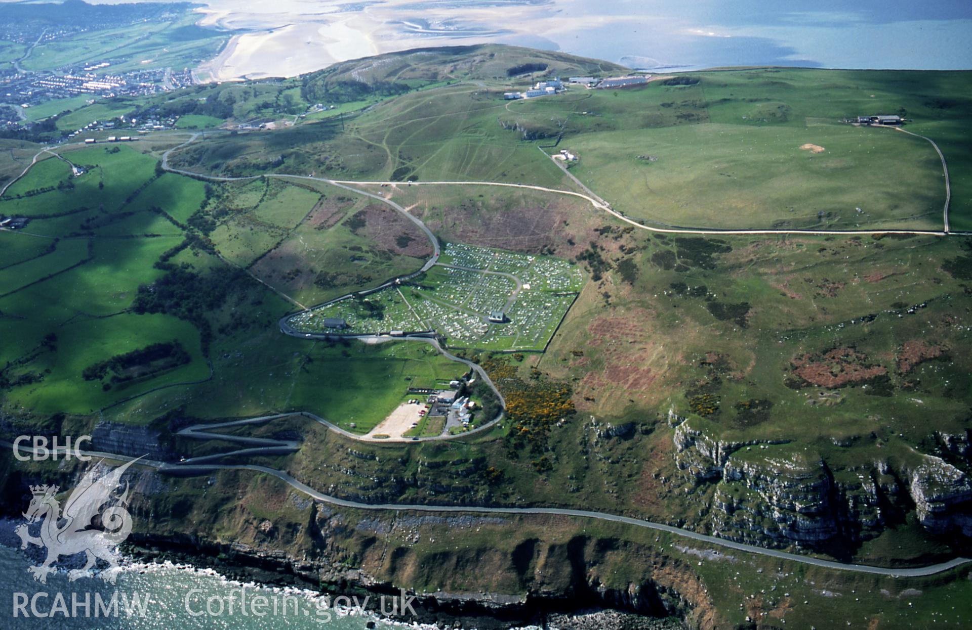 Slide of RCAHMW colour oblique aerial photograph of Garn Boduan Hillfort, taken by C.R. Musson, 4/4/1990.