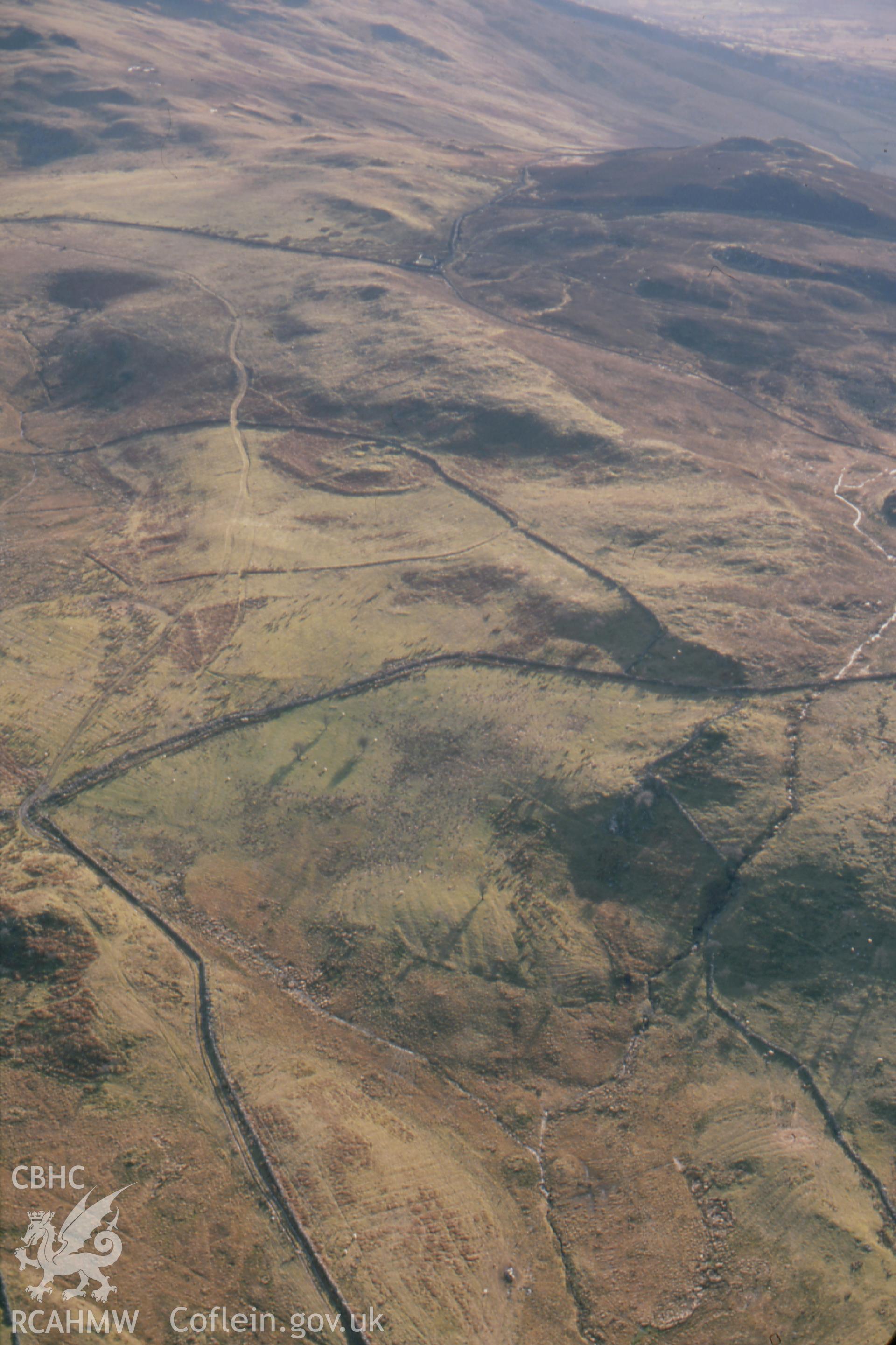 RCAHMW colour slide oblique aerial photograph of Ffridd Bod-y-fuddau Settlement, Trawsfynydd, taken on 26/02/1991 by CR Musson