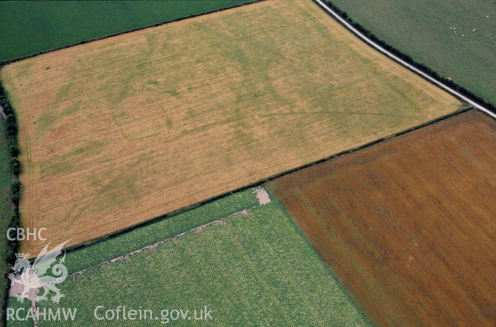 RCAHMW colour slide oblique aerial photograph of Hindwell Pallisaded Enclosure, Old Radnor, taken by C.R. Musson, 05/08/94