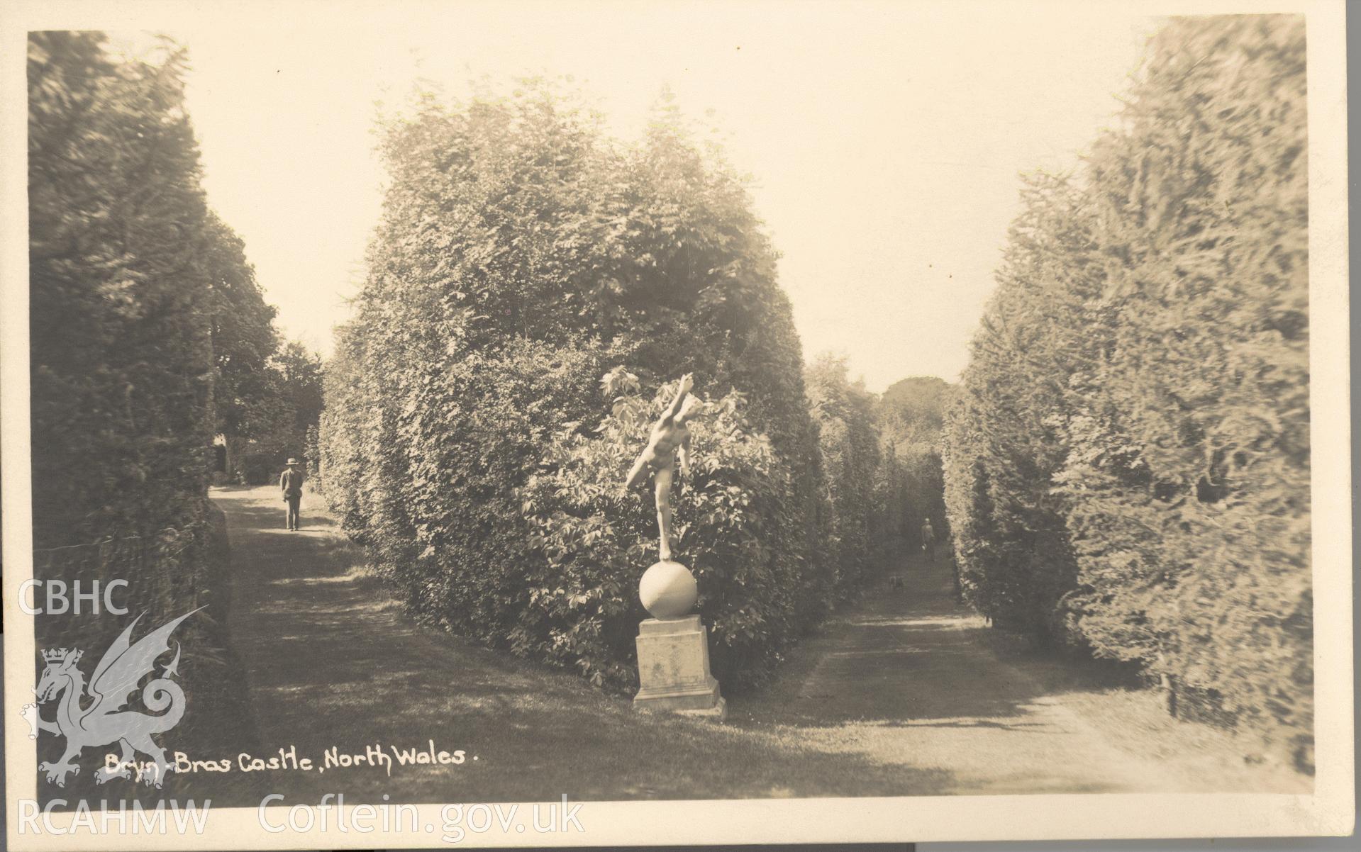 Digitised postcard image of Bryn Bras Castle garden, Llanrug, with statue (nude male). Produced by Parks and Gardens Data Services, from an original item in the Peter Davis Collection at Parks and Gardens UK. We hold only web-resolution images of this collection, suitable for viewing on screen and for research purposes only. We do not hold the original images, or publication quality scans.