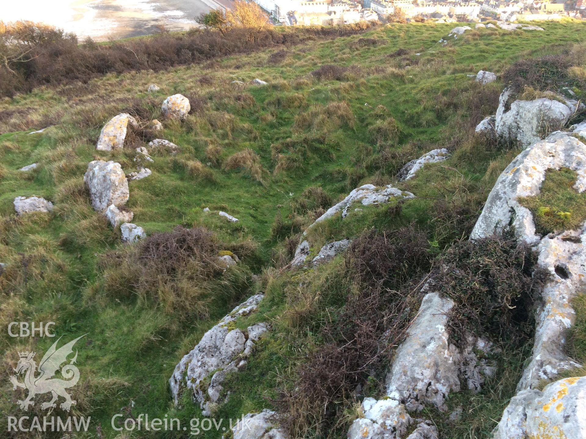 Colour photo showing hut circles on Pen y Dinas Hillfort, produced by Paul R. Davis,  14th March 2017.