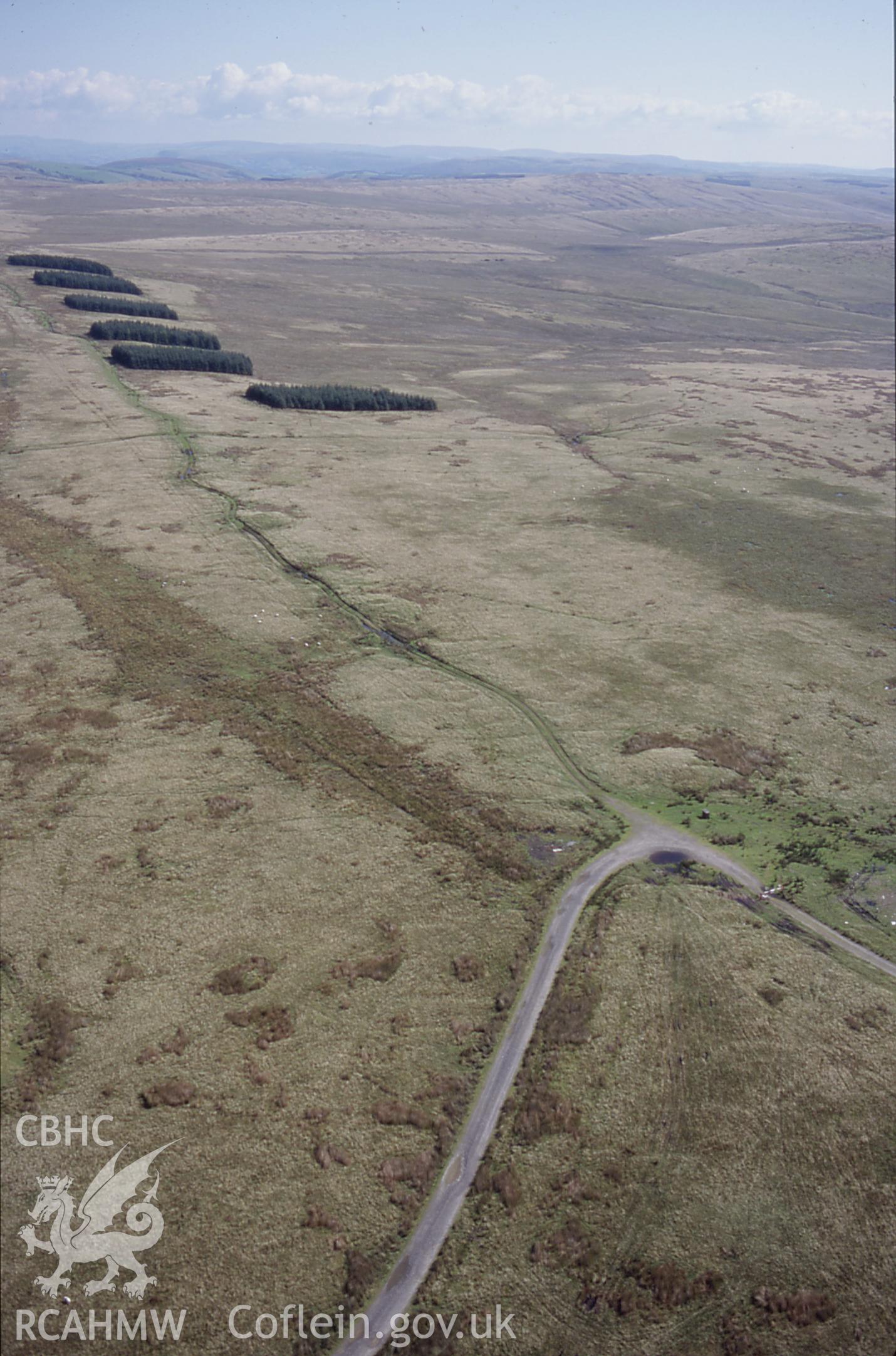 RCAHMW colour slide oblique aerial photograph of Tri Chrugiau Cairn II, Llangamarch, taken on 27/08/1998 by Toby Driver