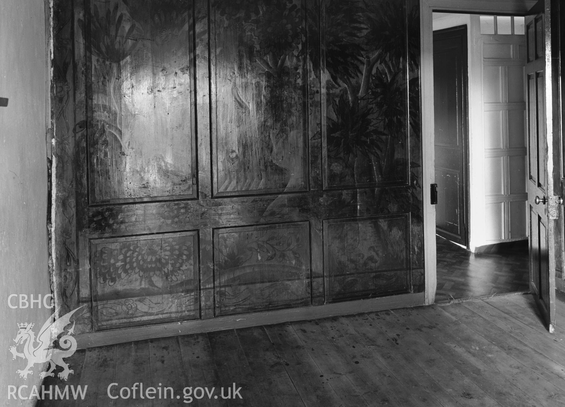 Interior view showing panelled partitions in a bedroom.