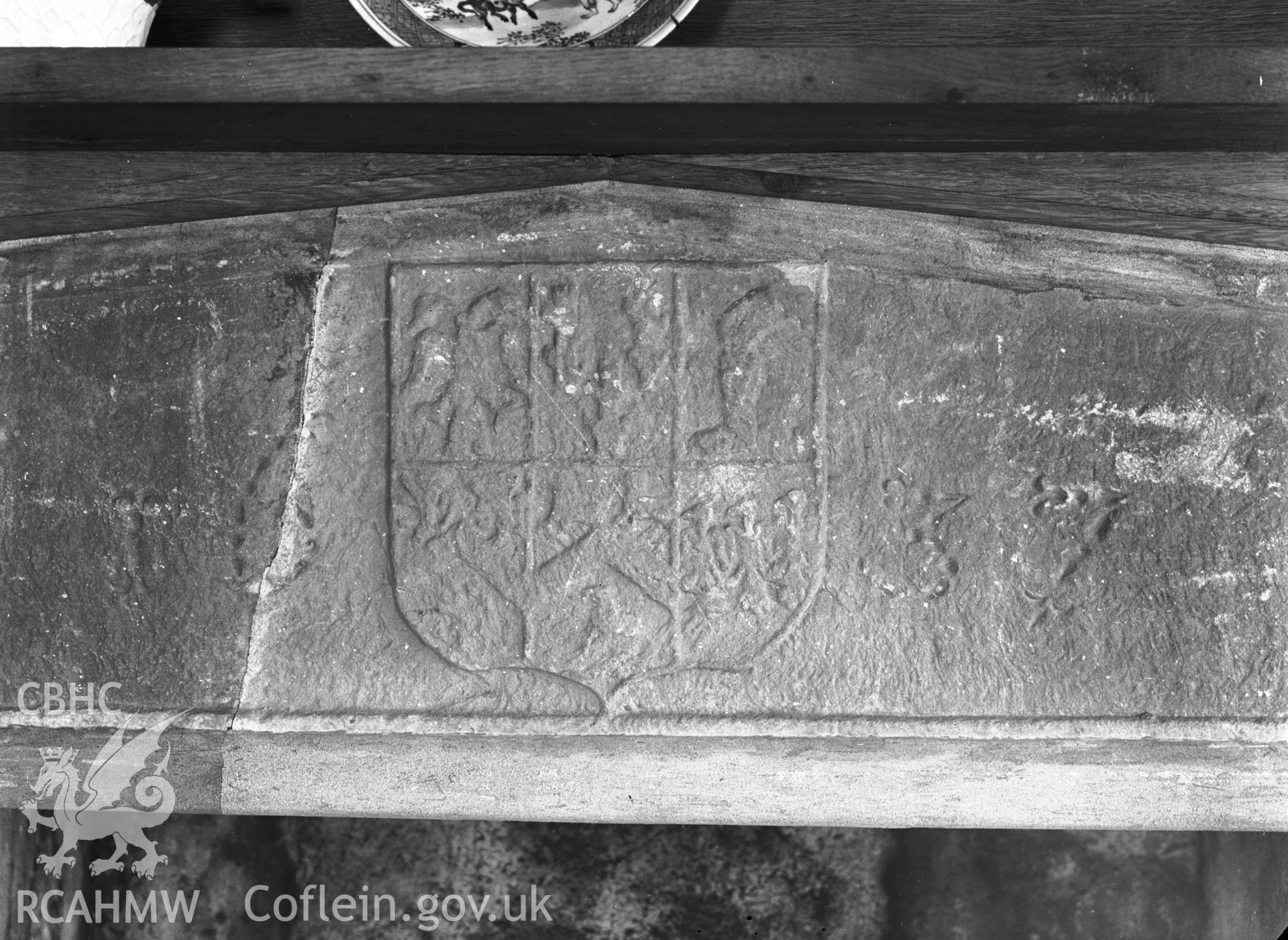 Interior view showing the dated stone transom over the fireplace on the first floor.