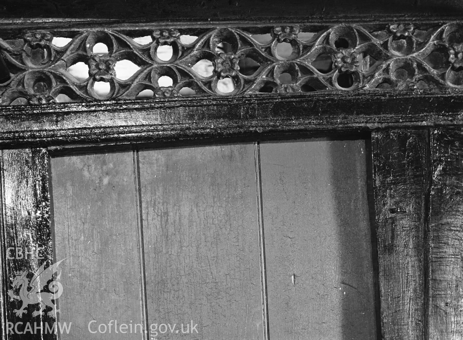 Interior view showing part of the old rood screen over the kitchen door.