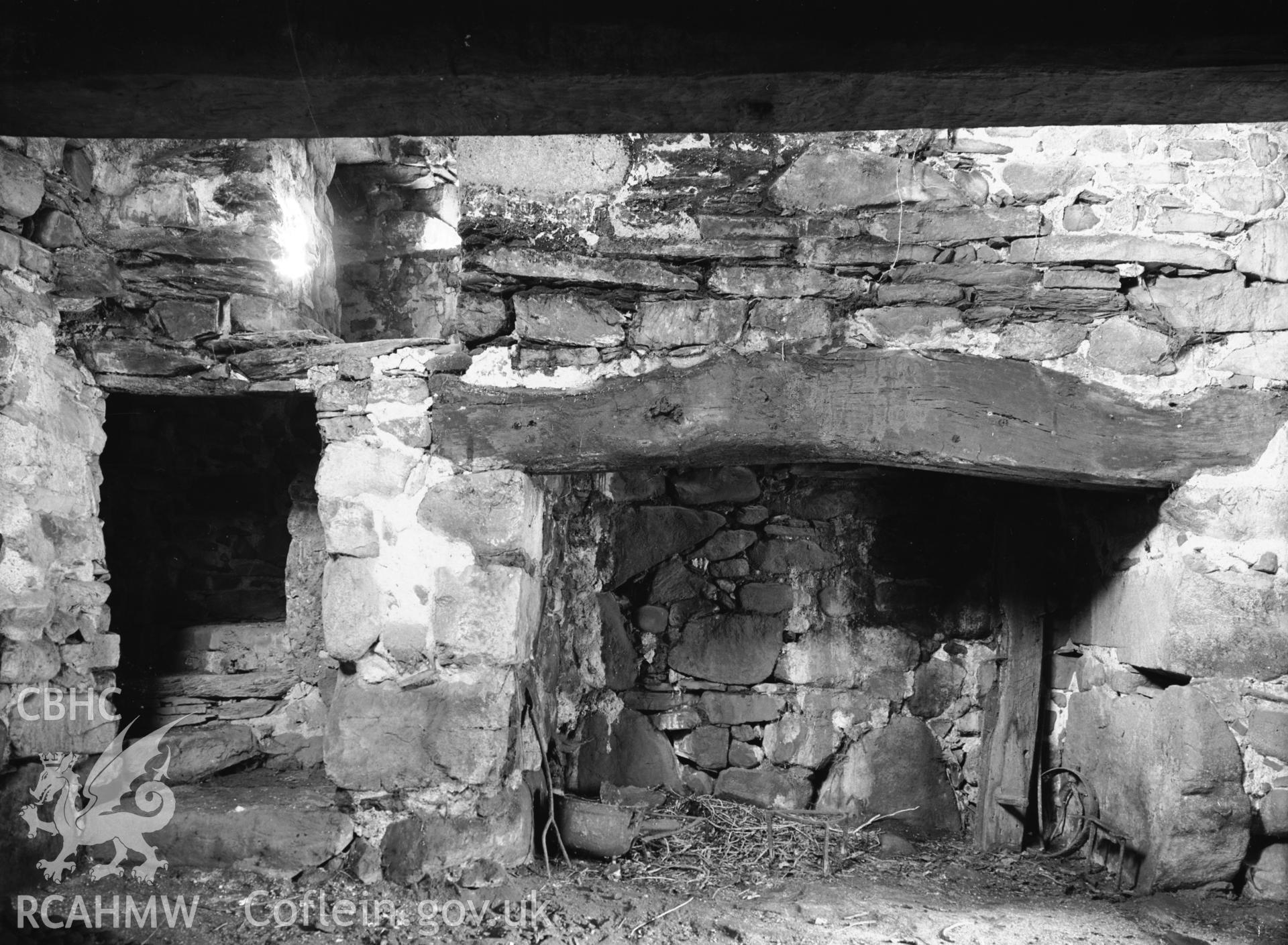 Interior view showing fireplace and spiral stone stairs.