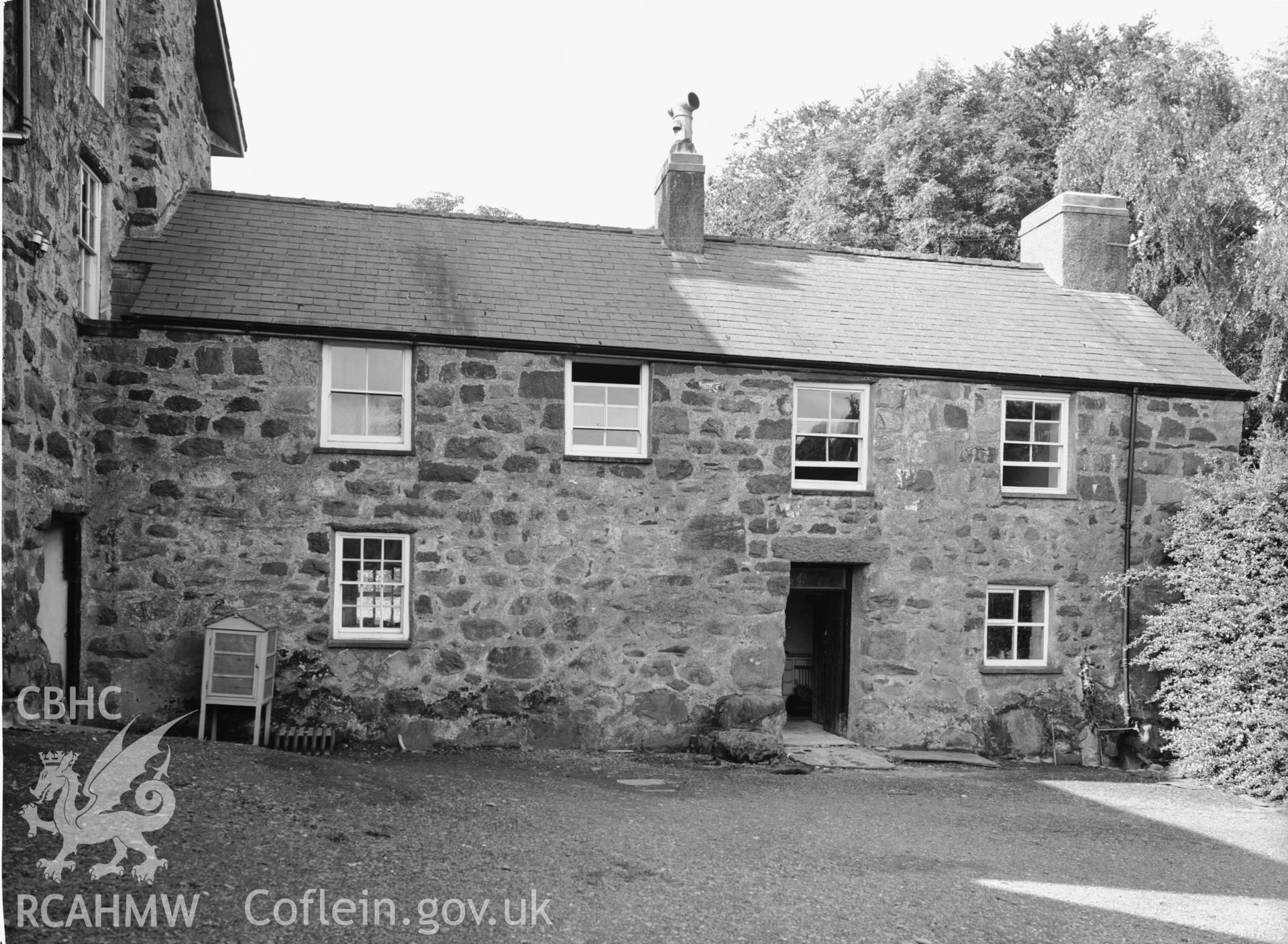 Exterior view showing cottage at rear.