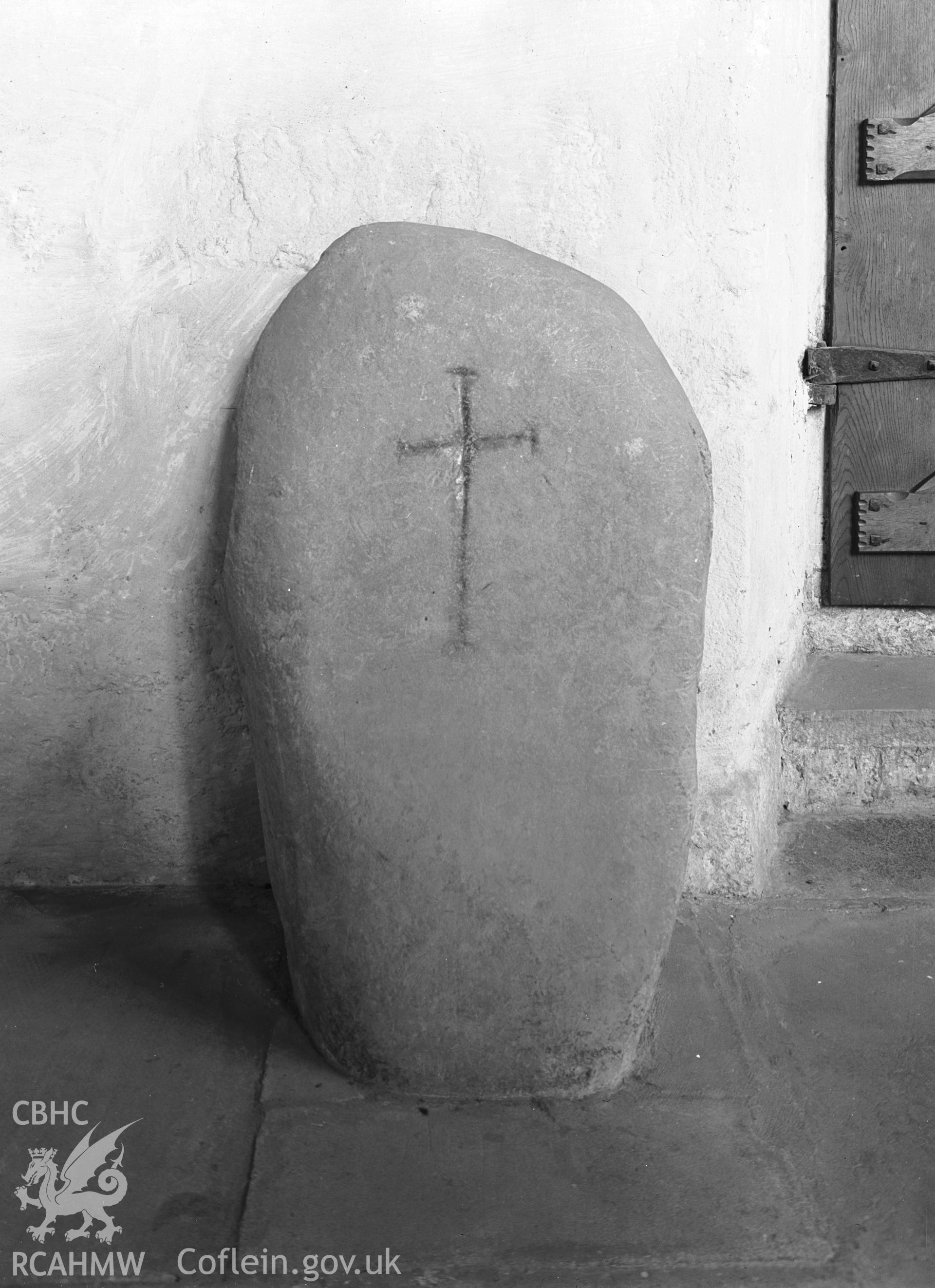 Interior view of the chapel showing cross-inscribed stone.