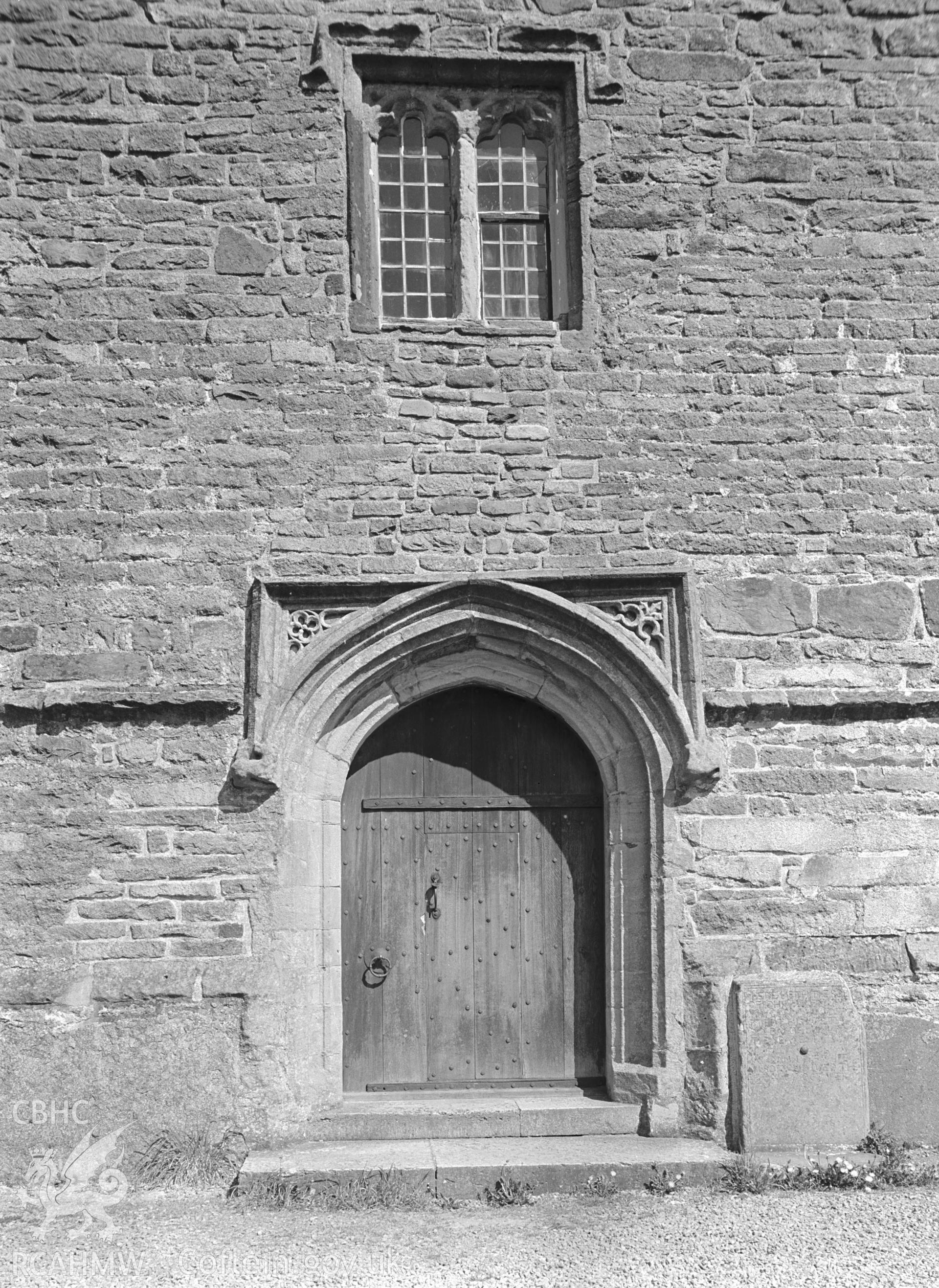 Exterior view of the chapel showing the west door and window.